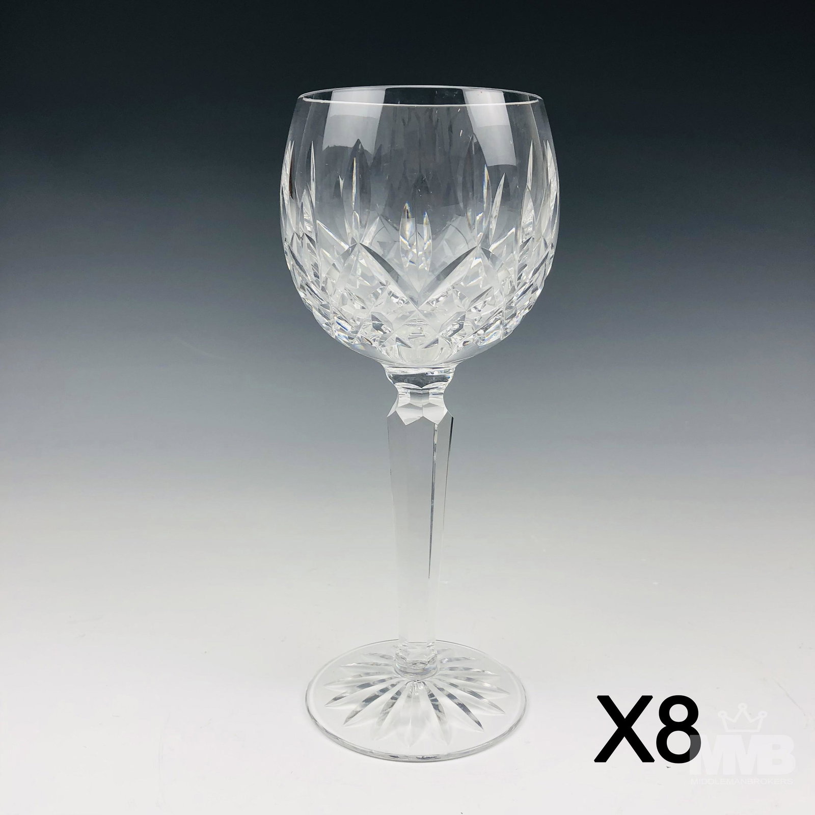 8 Waterford Crystal Lismore Balloon Wine Goblets: Modeled by Waterford in their Lismore pattern that was introduced in 1957. Design features vertical cuts over a diamond quilted body. Cut star burst pattern on the underside, to each. Good estate fres