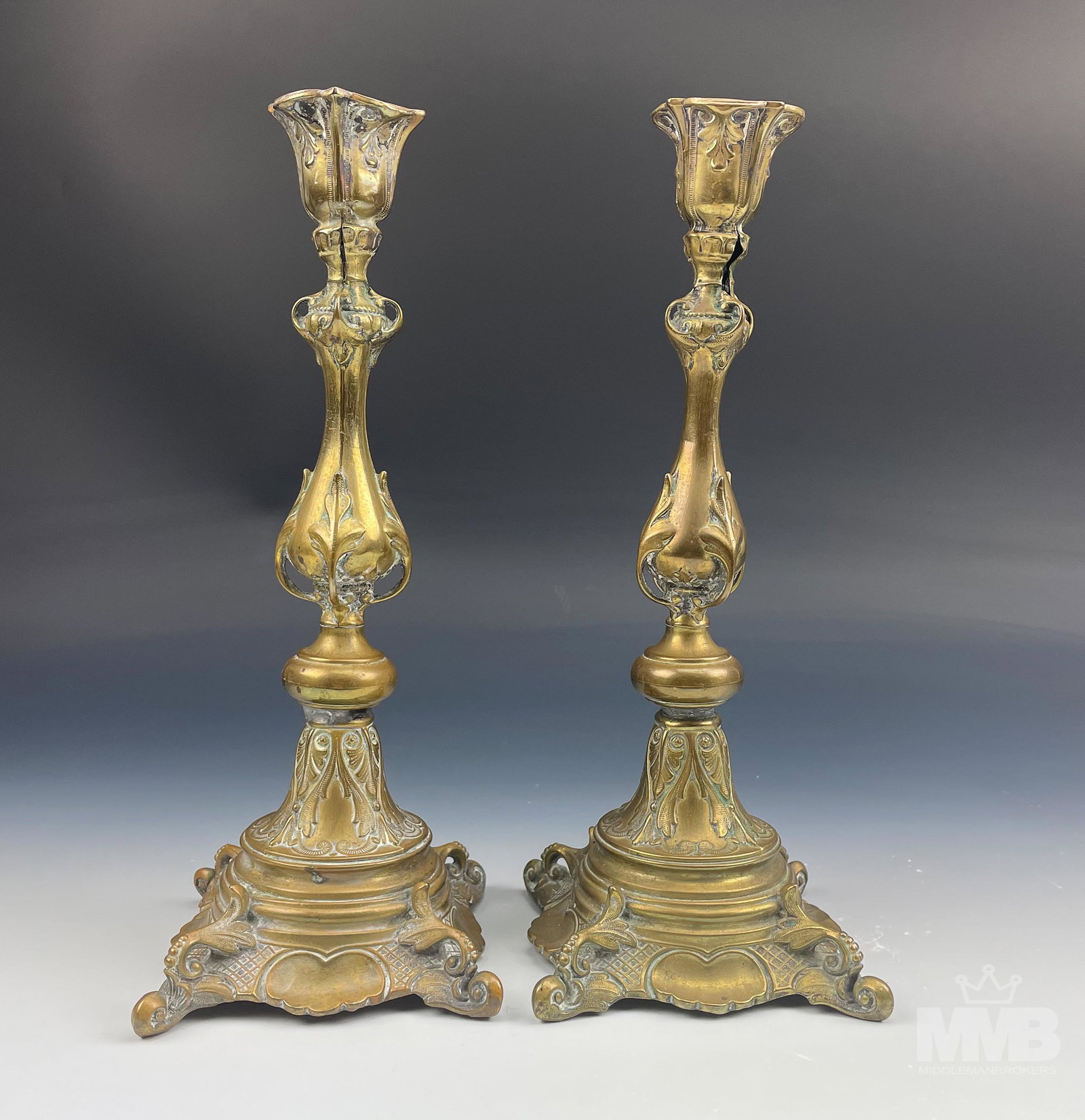 Pr Antique Brass Art Nouveau Mantle Candleholders: Pair of 19th century European origin brass candleholders. Both graced with raised relief decorative elements with a strongly influenced Art Nouveau theme. All original aged patina, No monograms. Good 
