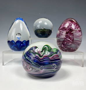 Joe Rice & Wheaton Village Art Glass Paperweights: Estate lot of four designer art glass paperweights. This lot features three multicolor swirl controlled bubble art glass paperwights. One is signed on bottom Joe Rice 1997, Wheaton Village, JM, and Br