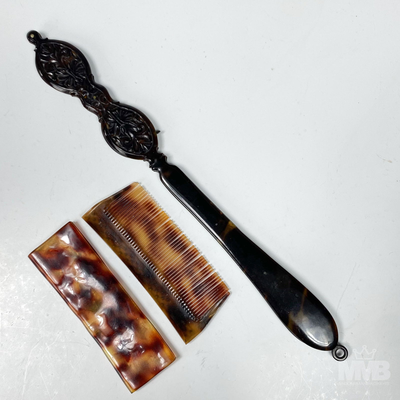 Antique Tortoise Shell Opera Glasses & Hair Comb: Antique theatre opera glasses and hair comb made out of tortoise shell. Hair comb measuring 3 3/4 in x 1 3/4 in, was made in France and has bejeweled accents. Theatre glasses measure 10 in x 1 in and