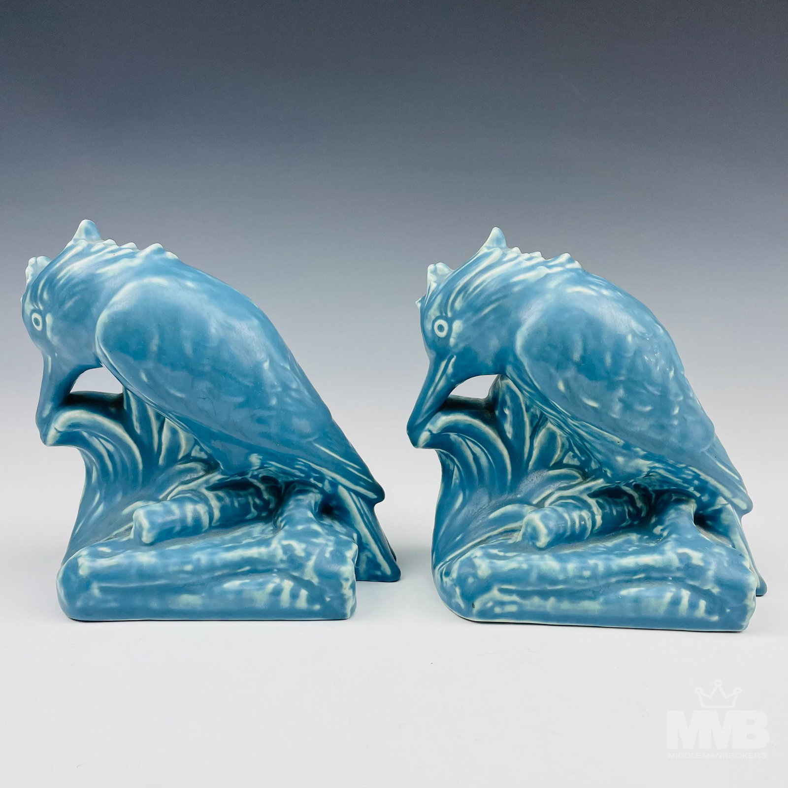 Rookwood William McDonald Kingfisher Bookends Pair: William Purcell McDonald ( American, 1863 - 1931 ). Known for pottery, floral still life and figure paintings. Was a member on the staff of the Rookwood Pottery Company as well as a member of the Cinc