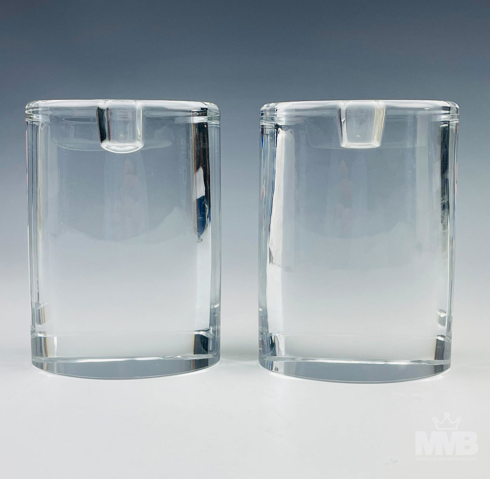 Pair Goran Warff Kosta Boda Glass Candle Holder: Goran Warff for Kosta Boda Swedish art glass candleholder pair. Signed Kosta Boda G. Warff on base. SHIPPING MMB will offer in-house continental USA shipping for $35 plus insurance. Gallery will refer