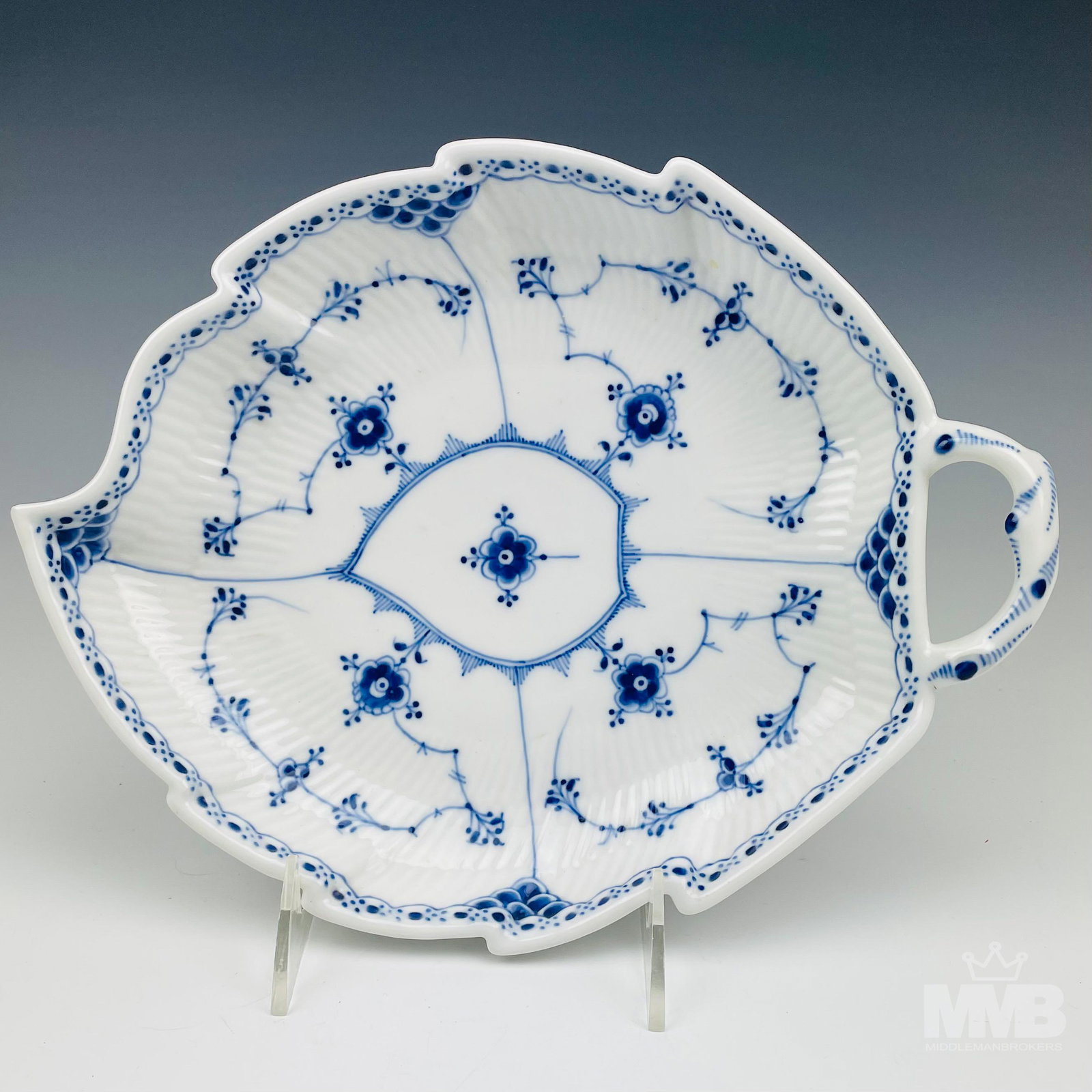 Royal Copenhagen Blue Fluted Half Lace Pickle Dish: This Danish porcelain pattern "Blue Fluted Half Lace" was first introduced in 1775. Designed by Arnold Krog in 1885. Leaf shaped form featuring a painted floral motif against a crisp white ground. Gla