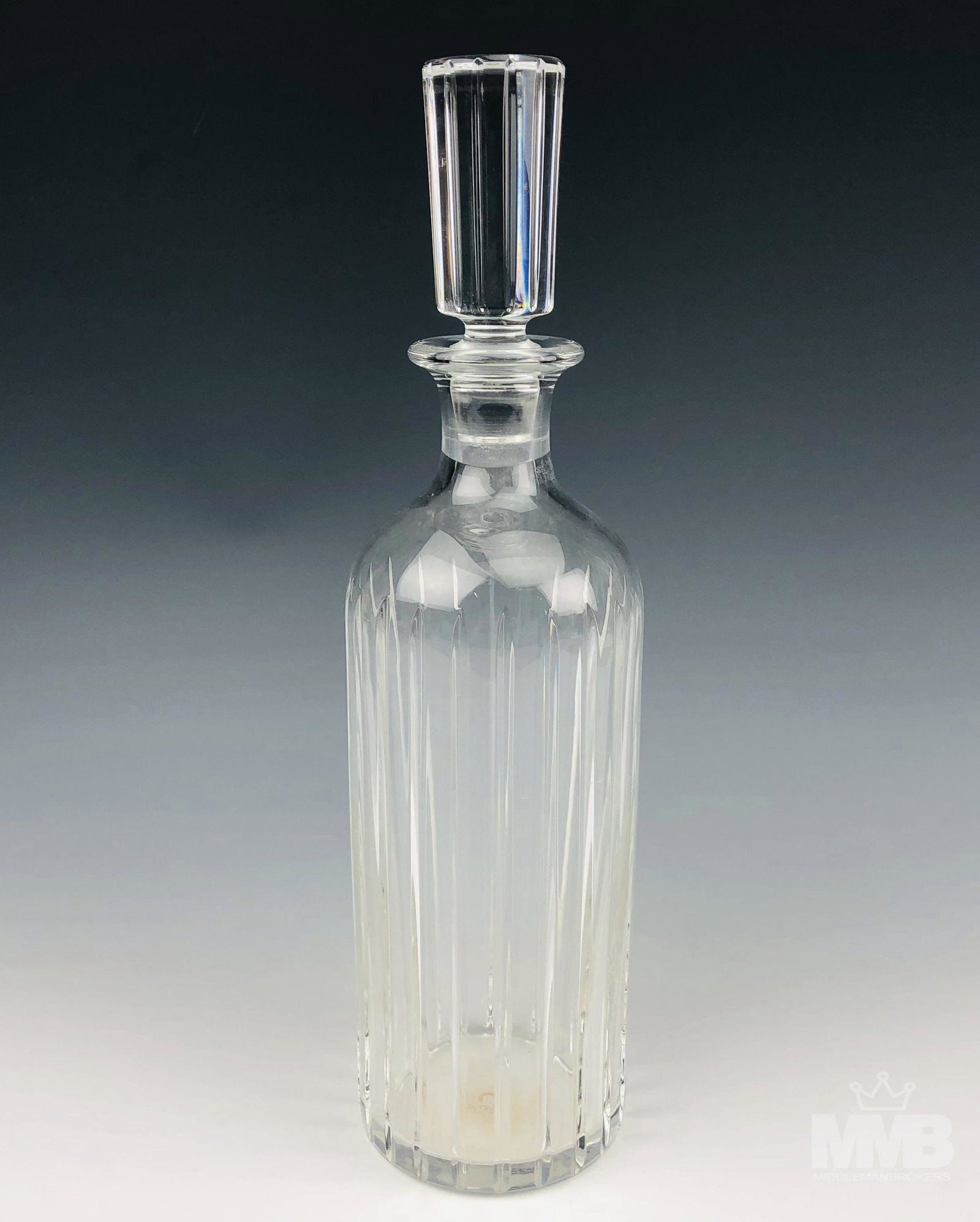 Baccarat Crystal Harmonie Alcohol Wine Decanter: Clear crystal art glass bar barware liquor alcohol decanter modeled by Baccarat in their "Harmonie" pattern which was introduced in 1975. Design features vertical cuts over a cylindrical / tubular sha