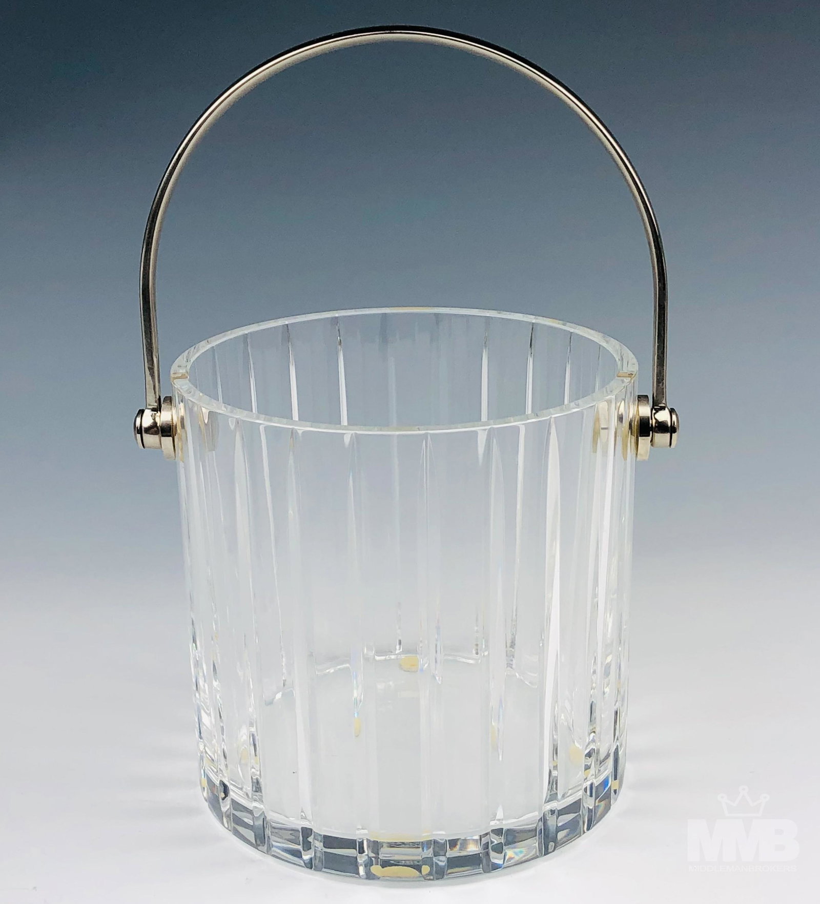 Baccarat Cut Crystal Art Glass Harmonie Ice Bucket: Sparkling crystal clear art glass ice bucket manufactured by Baccarat in their Harmonie pattern that was introduced in 1975. Features vertical cuts around the body. Smooth high mirror polished finish.