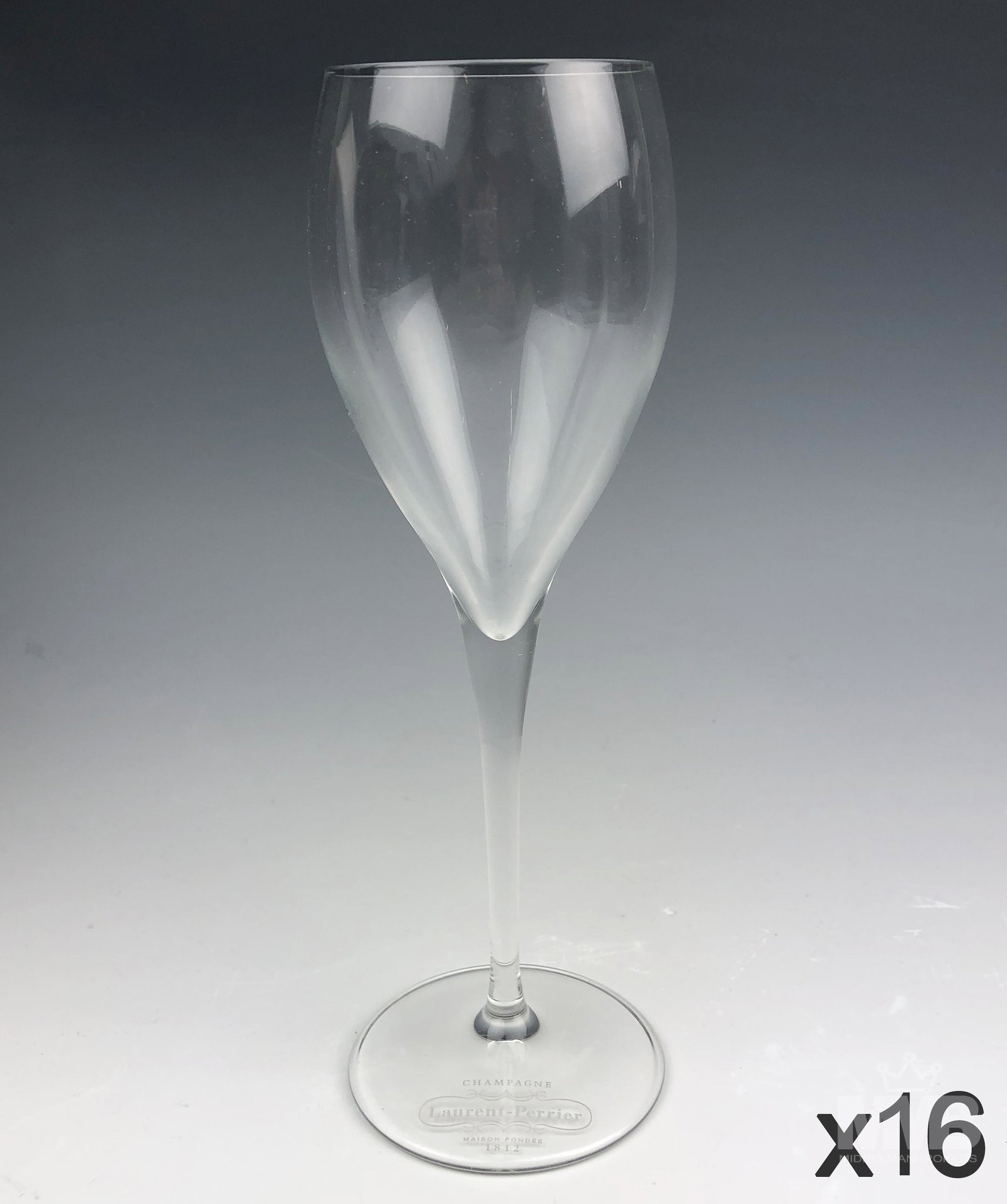 Set of 16 Laurent Perrier Crystal Champagne Flutes: Collection of sixteen Laurent Perrier Maison Fonee 1812 Champagne crystal flutes. SHIPPING MIDDLEMANBROKERS will offer in-house continental USA shipping for $55 plus insurance. Gallery will refer a lo