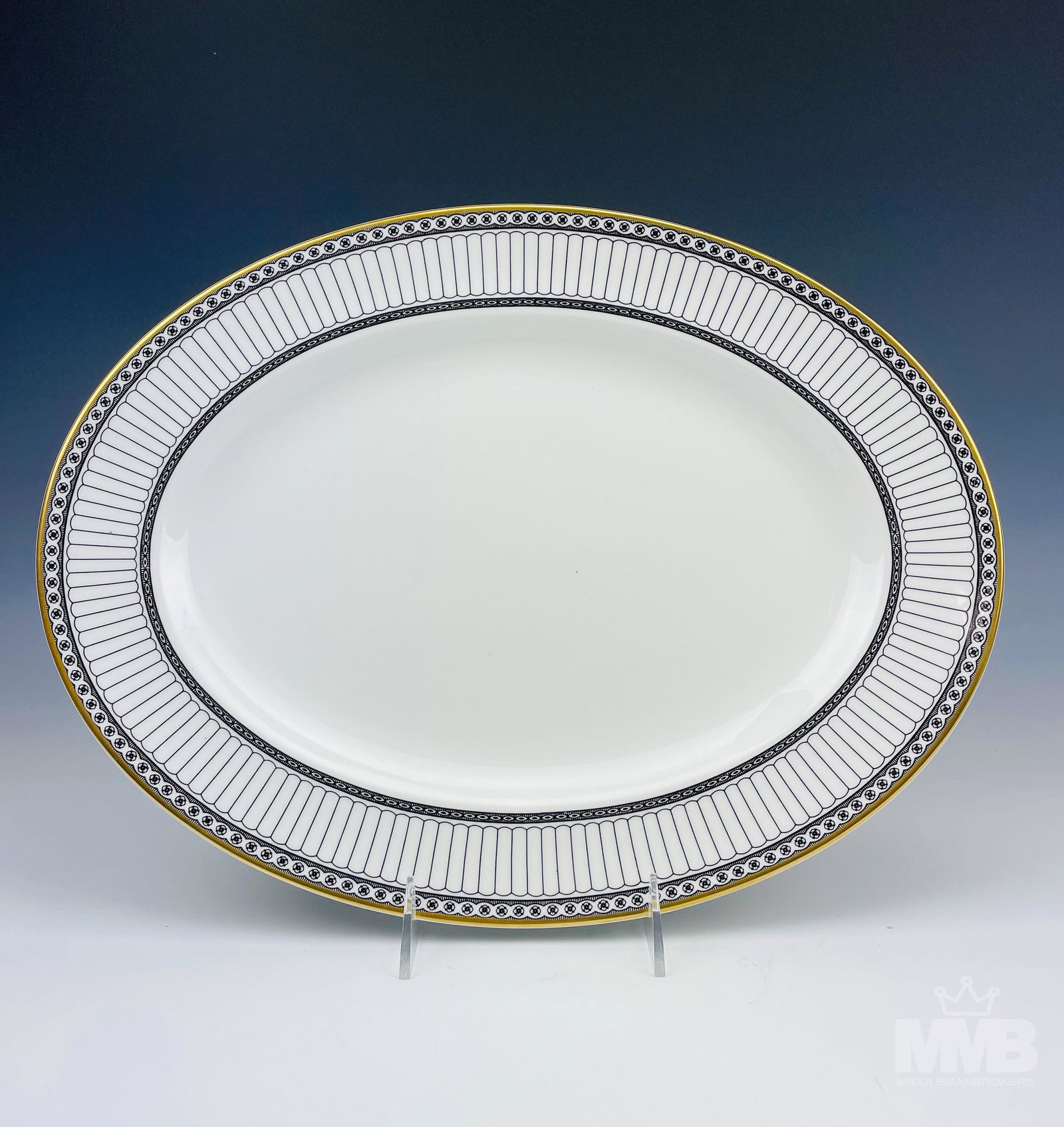 Wedgwood Black Colonnade Oval Serving Tray Platter: Design features black geometric lines and floral rosette forms around the rims, the borders with a rich gold trim lining. Production years : 1960 - 2004. Glazed finish. Signed with the black urn hallm