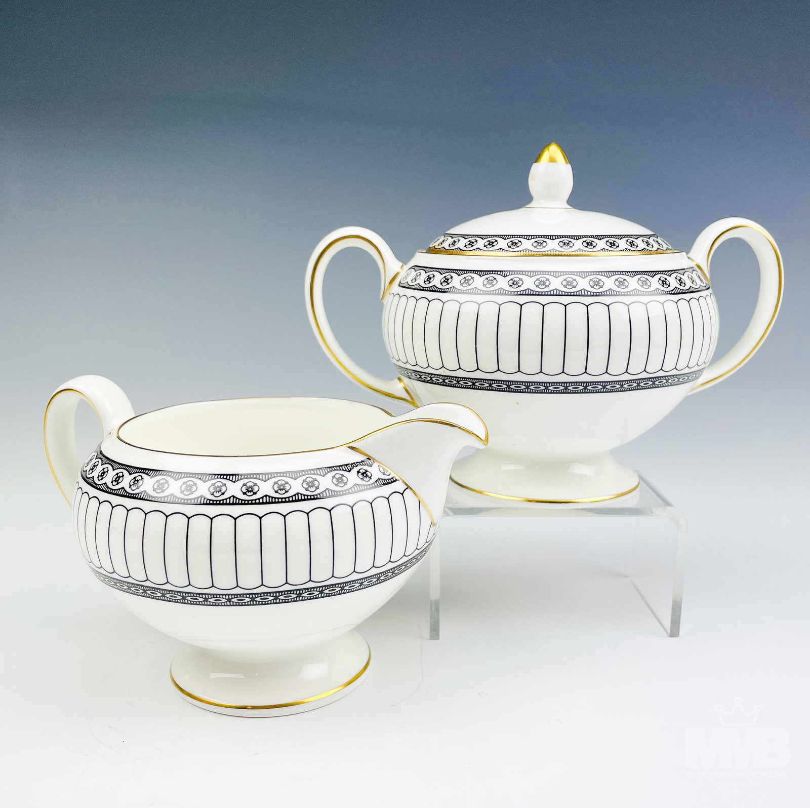 Wedgwood Black Colonnade Milk Creamer & Sugar Pot: Design features black geometric lines and floral rosette forms around the rims, the borders with a rich gold trim lining. Production years : 1960 - 2004. Glazed finish. Creamer measures 4 in. x 4 1/4 