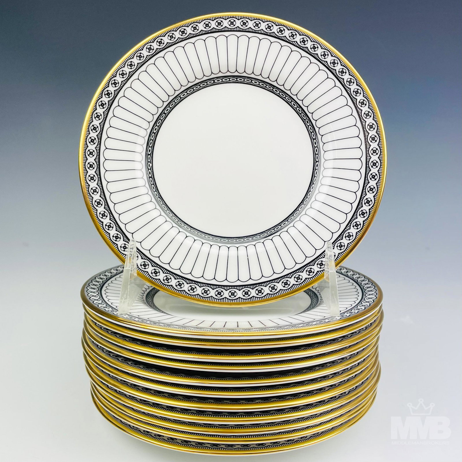 12 Wedgwood Black Colonnade Bread Butter B&B Plate: Design features black geometric lines and floral rosette forms around the rims, the borders with a rich gold trim lining. Production years : 1960 - 2004. Glazed finish . Signed with the black urn hall