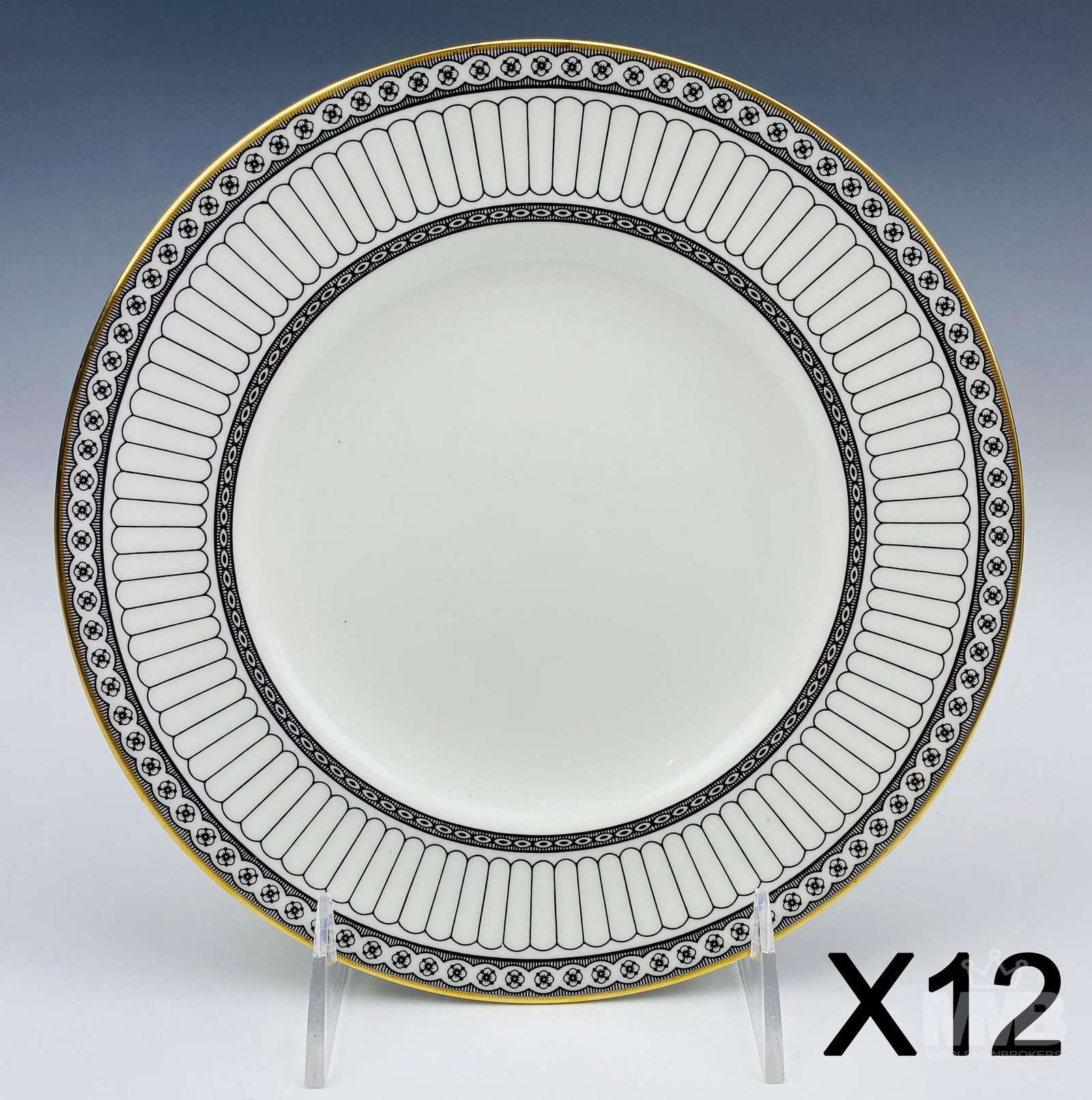 12 Wedgwood Black Colonnade 10 3/4" Dinner Plates: Design features black geometric lines and floral rosette forms around the rims, the borders with a rich gold trim lining. Production years : 1960 - 2004. Glazed finish. Signed with the black urn hallm