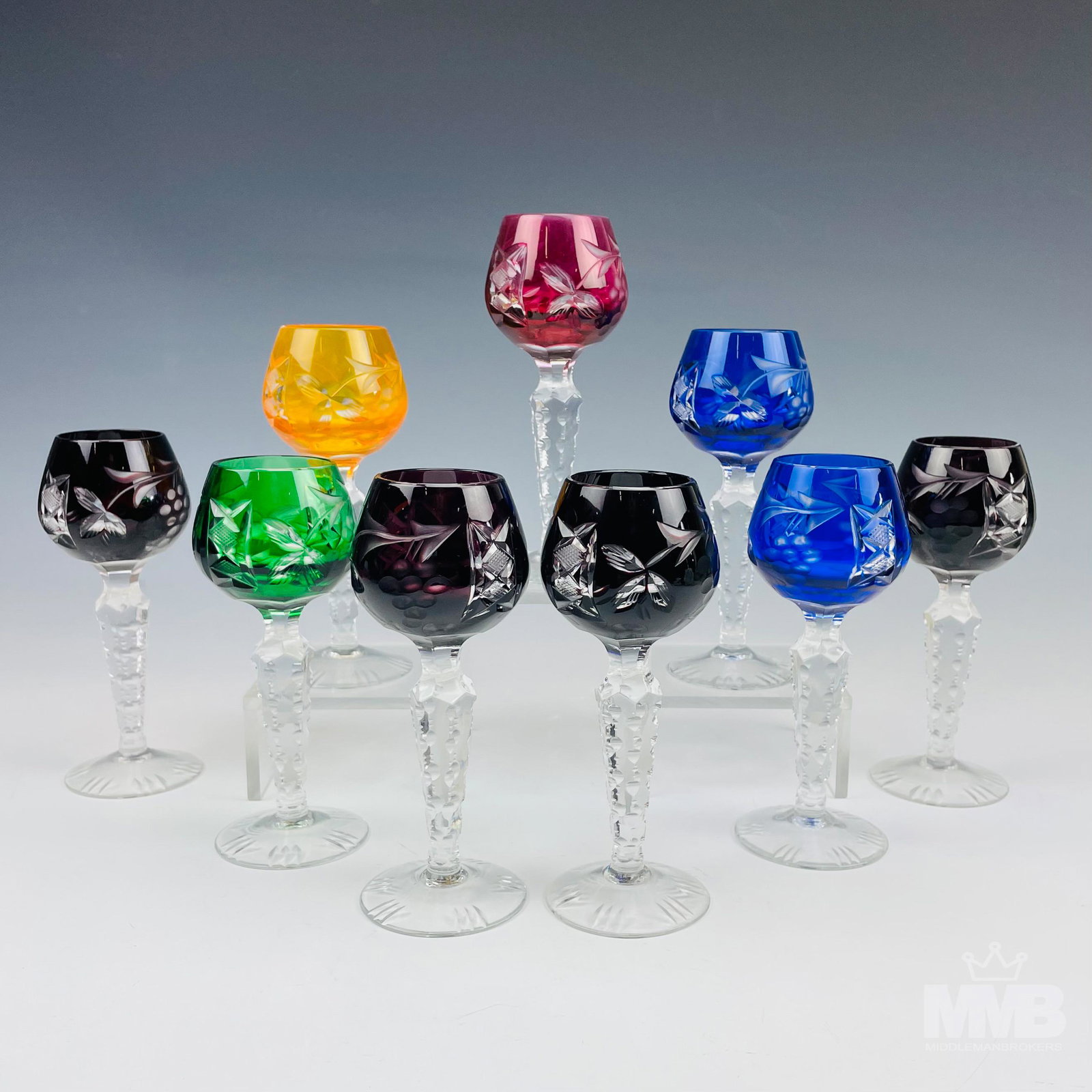 9 Ajka Crystal Marsala Bar Barware Wine Cordials: Hungarian origin cut to clear crystal bar barware cordial glass goblets. Colors include cobalt blue, ruby red, emerald green, pink cranberry and orange. Pattern : Ajka. Introduced in 2004. Feature cut