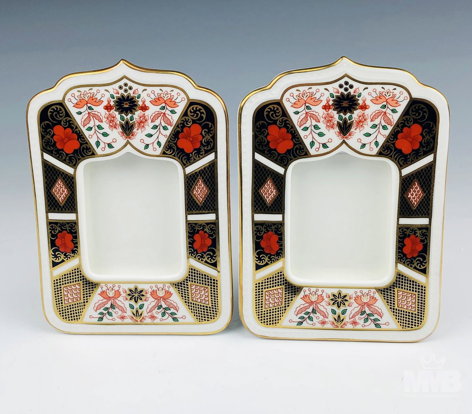 2 Royal Crown Derby Old Imari Photo Picture Frames: Fine English bone china photograph frames beautifully decorated in a rich color palette of red oranges, cobalt blues, milk whites and royal golds. Graced with floral patterns, diamond quilts and cloud
