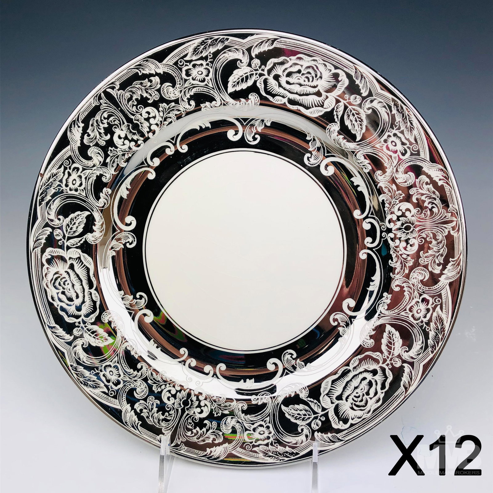 12 Johnson Brothers Pareek Silver Dinner Plates: Set of twelve Johnson Brothers England pareek china dinner plates. Features a silver and white motif border with a white center. Marked on bottom. SHIPPING MIDDLEMANBROKERS will offer in-house contine