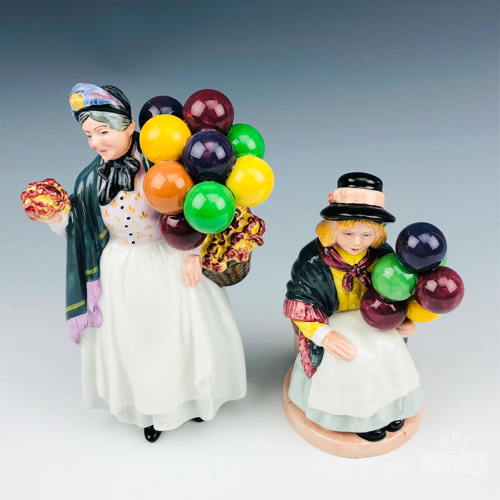 Estate Lot 2 Royal Doulton Bone China Figurines: Includes the following figurines with name, model number, designer and production years. 1 x Balloon Girl Hn2818. Designed by William K. Harper. 1982 - 1977. 1 x Biddy Penny Farthing HN1843. Designed 