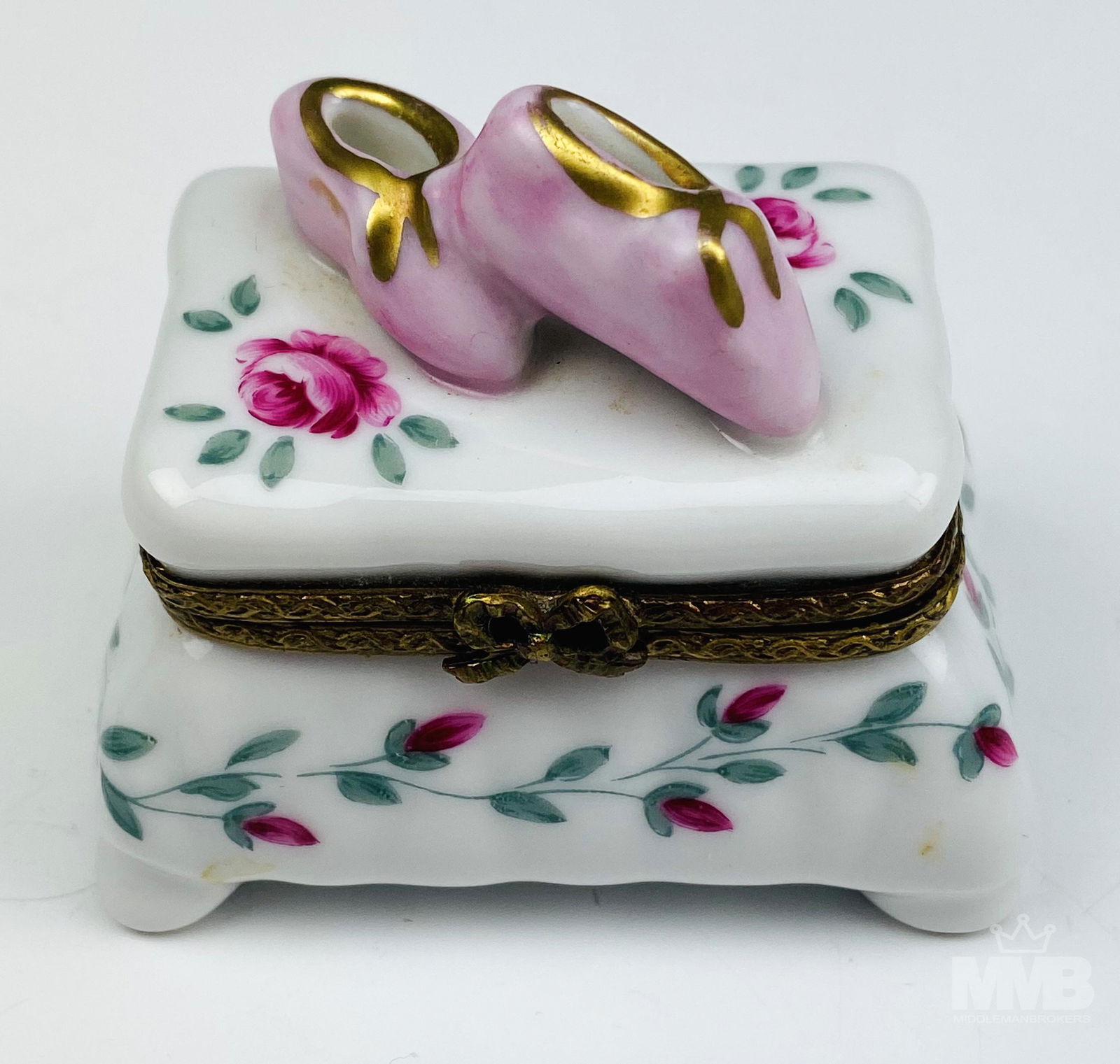 Limoges France Pink Baby Shoes w Roses Trinket Box: Features hand painted pink colored baby shoes surmounted atop the lid against a white ground with red pink roses and green leaves. The floral decoration carried on around the base. Similar rose motif
