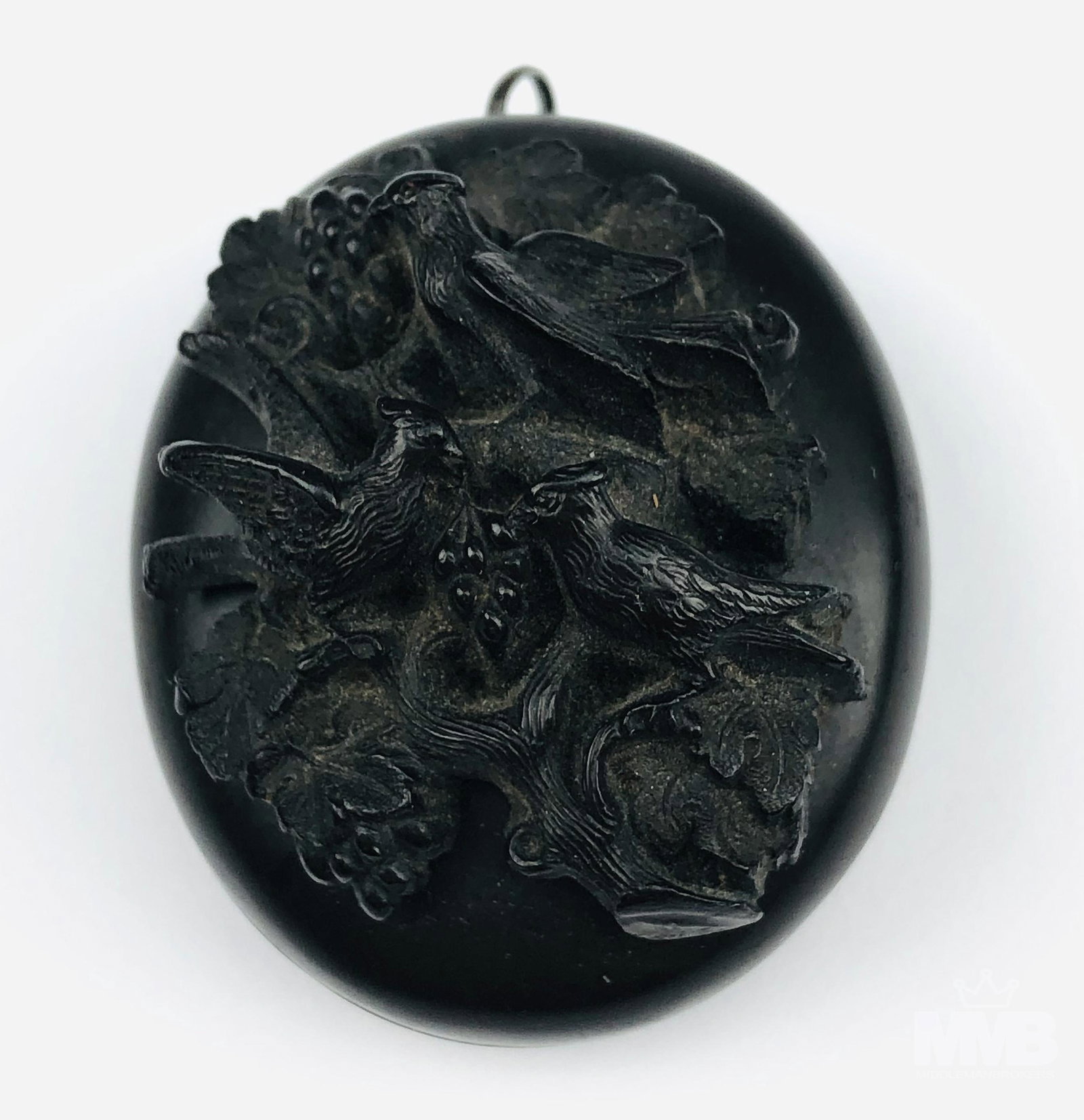 Antique Victorian Carved Jet Pendant Photo Locket: Antique hand carved black organic rock oval photo photograph picture pendant locket. Graced with a raised 3 dimensional bird and foliage design on the front. Inner borders with a carved design. Simple