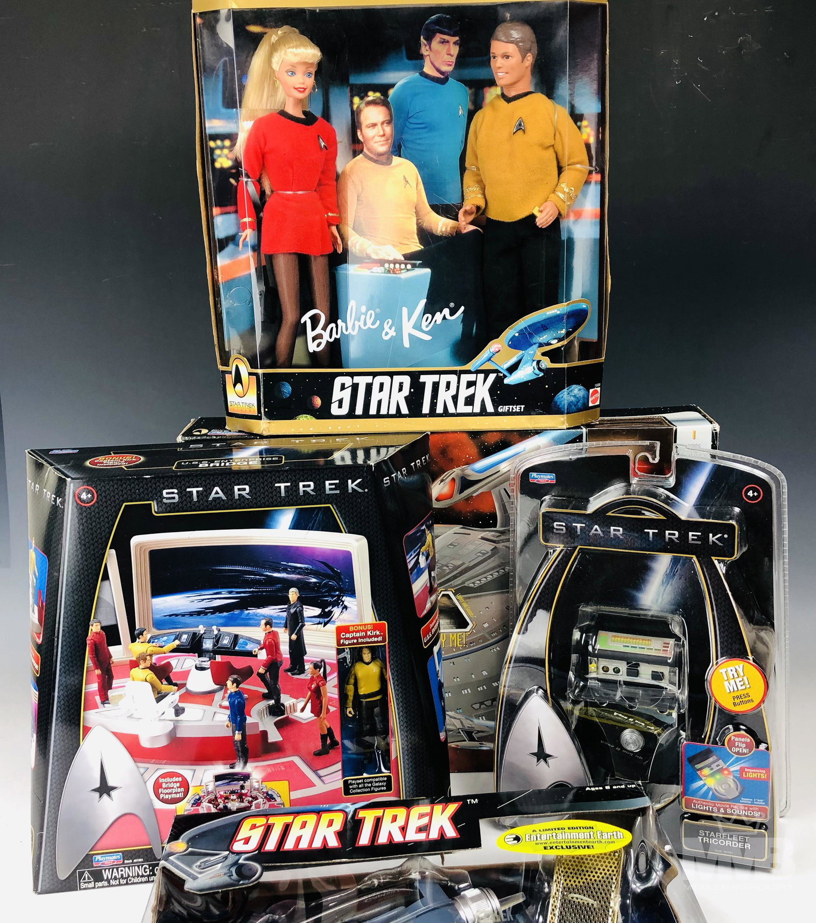 Star Trek Tricorder Phaser Barbie & USS Enterprise: Collection of Star Trek and Starfleet related cosplay gear and collectible toys. Includes: Diamond Select Toys Phaser Pistol and Communicator Set in original box, produced circa 2008 (box measures 10"