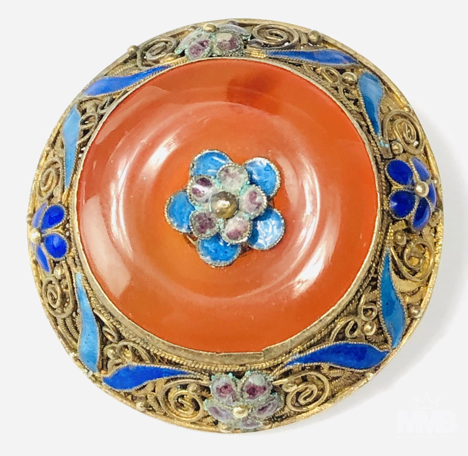 Chinese Silver Filigree Carnelian Cloisonne Brooch: Chinese gold gilt over silver brooch pin. Features a fine wire filigree with blue floral cloisonne enamel embellishments. Further decorated with a center carnelian stone. Marked silver. Weighs 19 gram