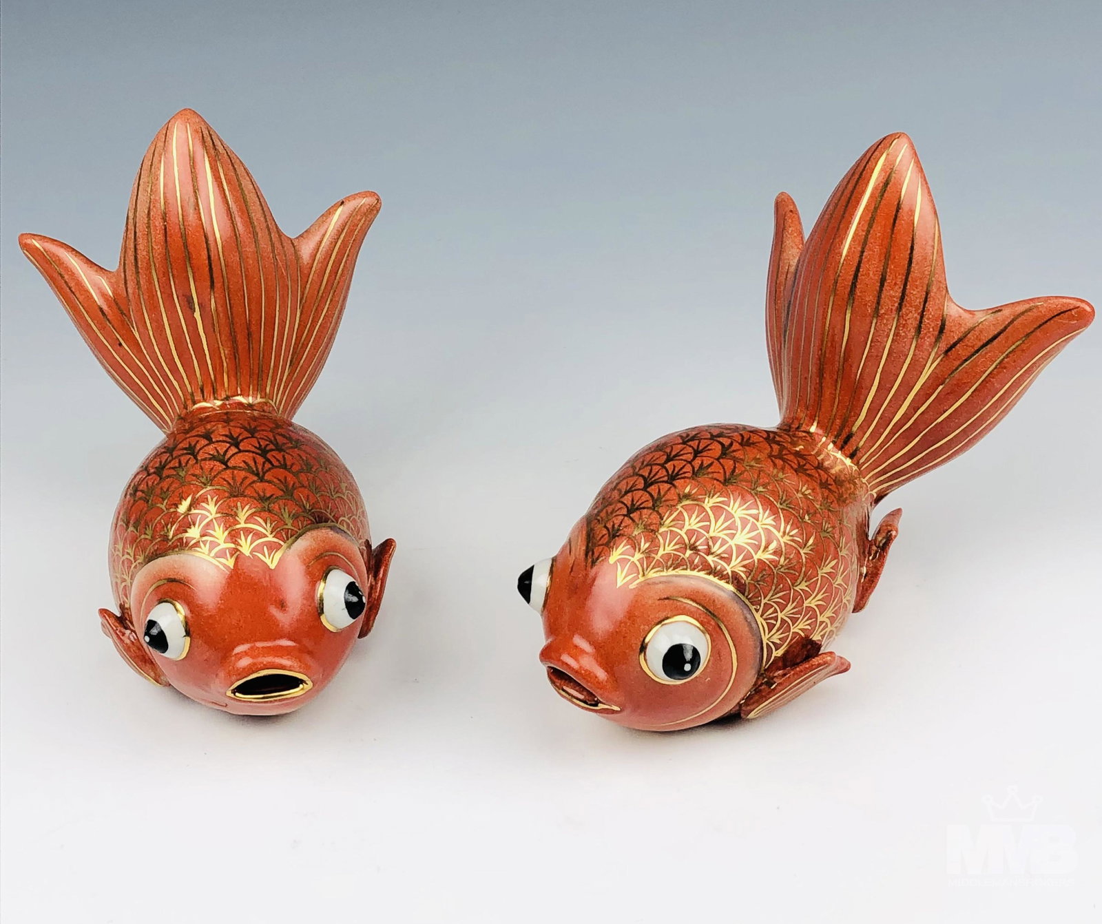 Pair Chinese Export Porcelain Goldfish Figurines: Fetures a pair of hand painted orange colored spectacle eyed fantail goldfish. Graced with gold accented scales with gold linings on the tail, around the yes and the lips of the mouth. Partial glazed 