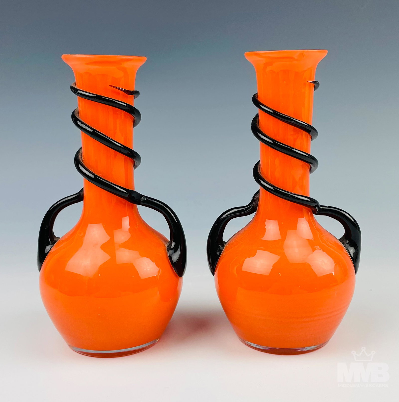 Pair Loetz Style Orange Tango Art Glass Bud Vases: Tango glass or mono colored glass is a technique originally created by Loetz in the 1930's. Examples reproduced by companies such as Kralik, Ruckl and Welz. These bright colored vases are hand blown i