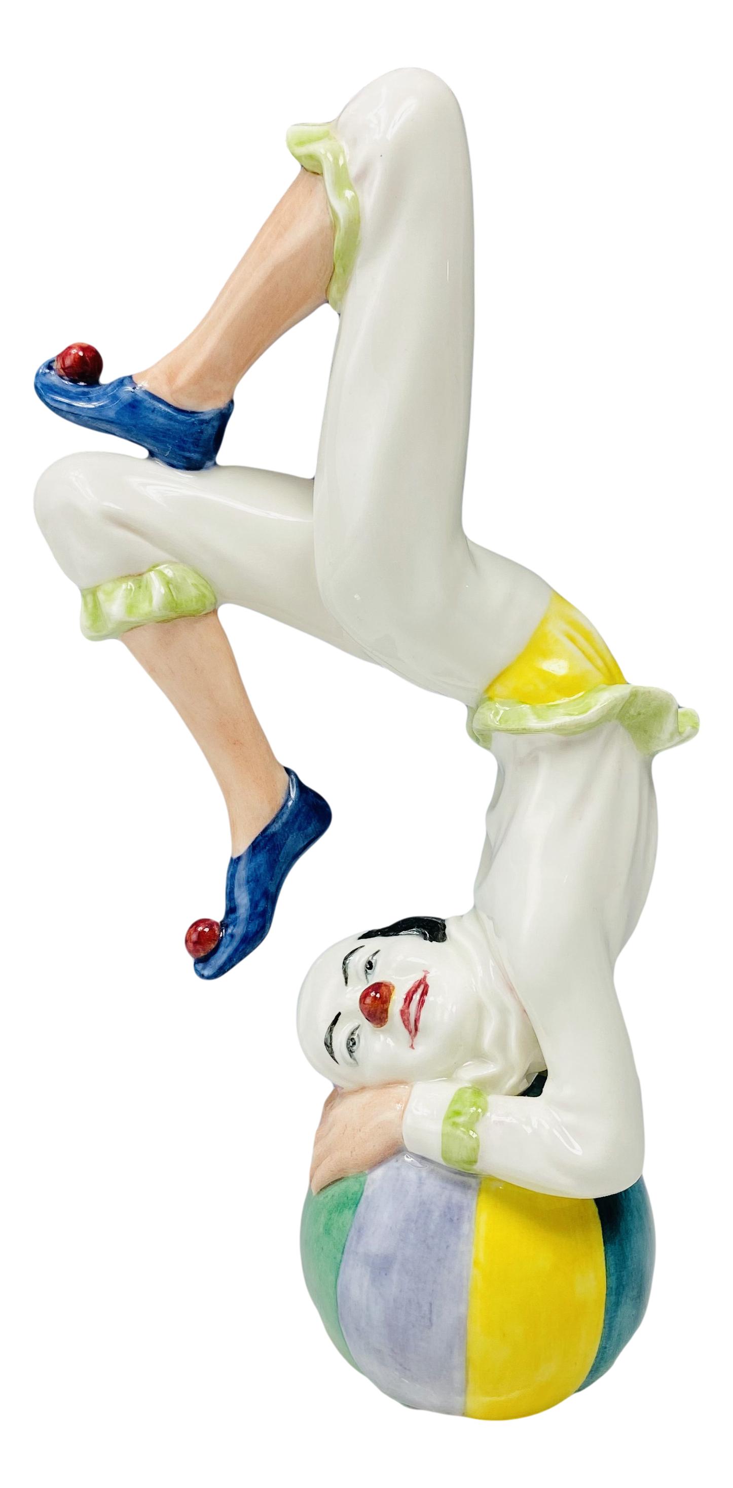 Royal Doulton "Tumbling" HN 3283 Clown Figurine: Designer : Douglas V. Tootle. Model number HN 3283. Production years : 1990 - 1994. Part of the Clowns group themed series. Finish : Glazed. Subject matter features this circus jester entertaining the