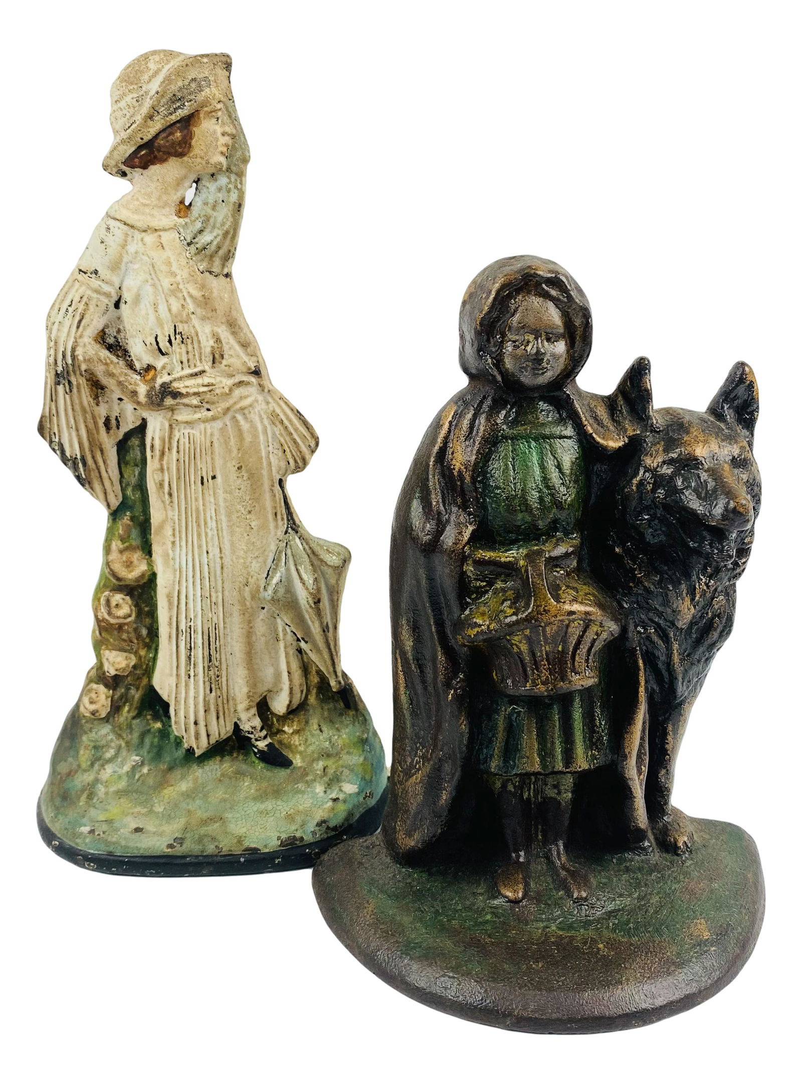 Cast Iron Woman & Lil Red Ridding Hood Doorstops: Cast iron door stops. Lot includes:(1) National Foundry number 94 Little Red Ridding Hood and Wolf. Measuring 7.25" x "5.5 x 4". and (1) woman measuring 9.5" x 5" x 3"; Inventory number 8 on verso. No