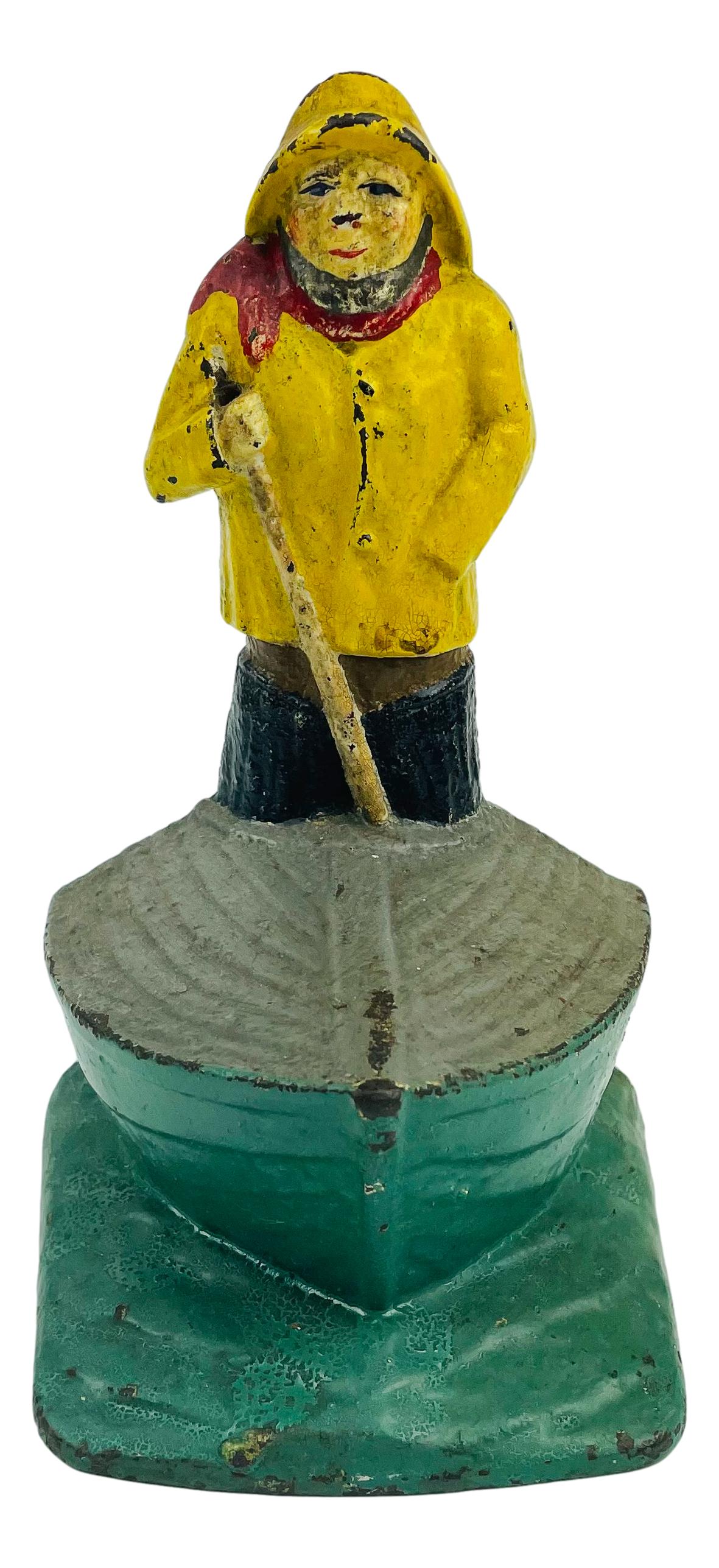 Cast Iron Nautical Fisherman in a Boat Doorstop: Cast iron door stop featuring a Fisherman standing in his boat. No apparent markings, being advertised in the style of Hubley and Bradley & Hubbard. SHIPPING MIDDLEMANBROKERS INC. will offer in-house 