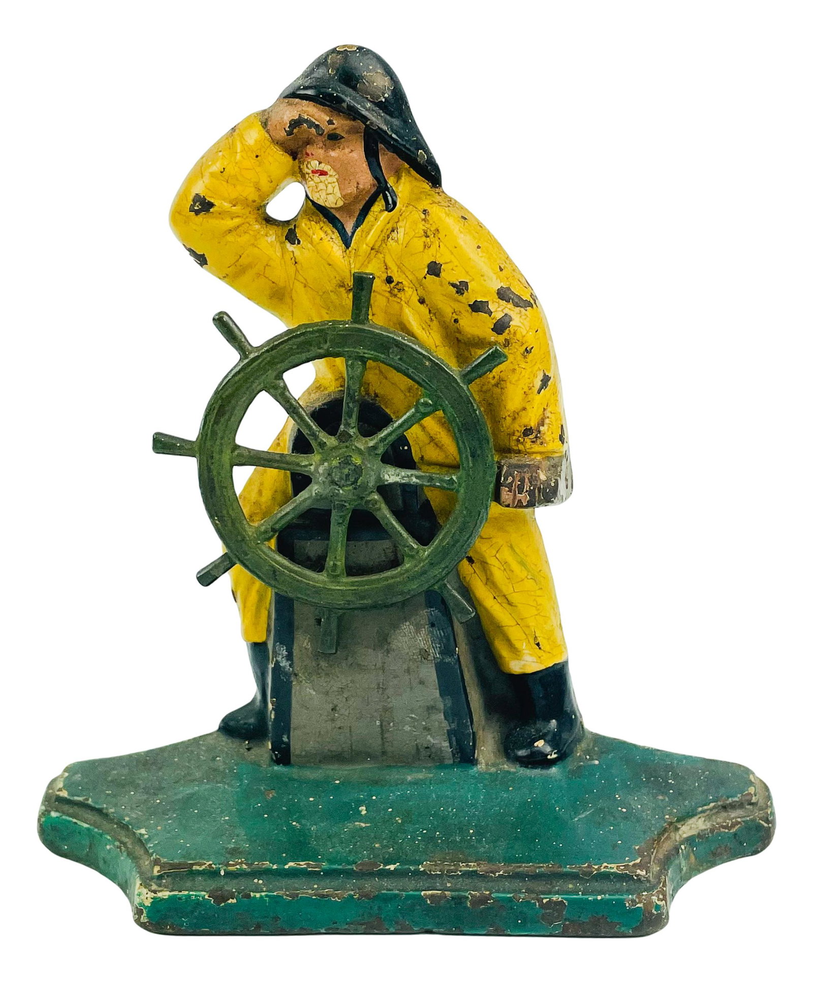 Cast Iron Nautical Captain Steering Boat Doorstop: Cast iron door stop featuring a Captain steering the boat while looking off into the distance. No apparent markings, being advertised in the style of Hubley and Bradley & Hubbard. SHIPPING MIDDLEMANBR