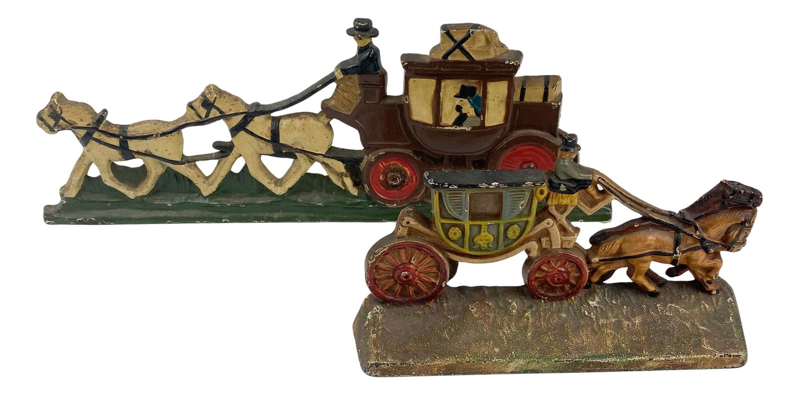 Hubley Cast Iron Horse & Stage Coach Doorstops: Cast iron door stops featuring horses pulling a stage coach. Lot includes: (1) Hubley Manufacturing Company inventory number 379 stagecoach . Measuring 4 " x 7" x 2 ". and (1) stagecoach measuring 5"