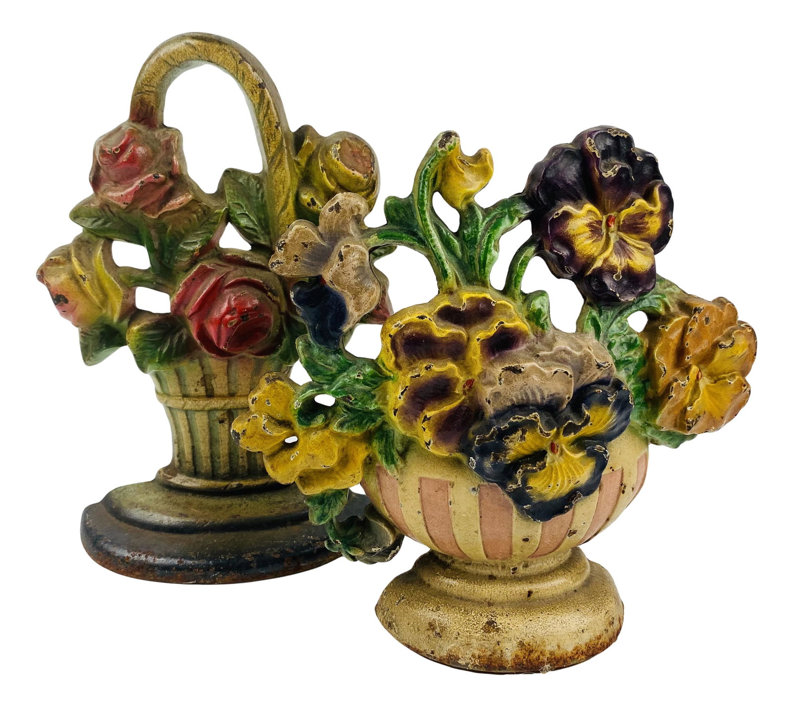 Cast Iron Pansy Bowl & Flower Basket Doorstops: Cast iron door stop lot. Lot includes (1) Hubley Manufacturing Company pansy bowl measuring 7" x 6.5" x 2". Inventory number 256; and (1) flower basket measuring 8.25" x 6" x 2". No other apparent mar