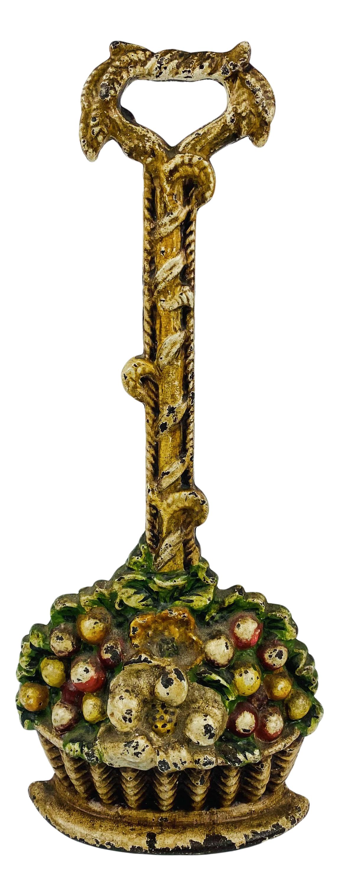 Cast Iron Long Handle Flower Basket Doorstop: Cast iron door stop featuring flowers in a long handled basket. No apparent markings, being advertised in the style of Hubley and Bradley & Hubbard. SHIPPING MIDDLEMANBROKERS INC. will offer in-house 