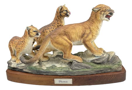 Boehm Puma Family #5002 LE Porcelain Cat Sculpture: Hand painted bisque porcelain wildlife animal group figurine. Features a mother Puma with 2 cubs on a mountainous terrain. Part of the Endangered Animal group themed series. Executed in a limited edit