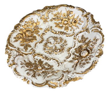 Meissen Porcelain White & Gold Floral Serving Bowl: Features a raised relief floral decoration in the 4 cartouches around, the center with a scroll design. Design accented with a gold coloration against a crisp white glazed ground. Factory First.