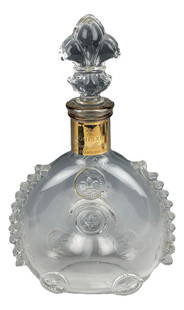 Baccarat Crystal Louis XIII Champagne Bar Decanter: French crystal barware decanter. Of flattened body with dimpled center and applied prunts to the shoulders. Fleur de lis crystal glass stopper. Gold tone band around the collar. Signed with the Baccar