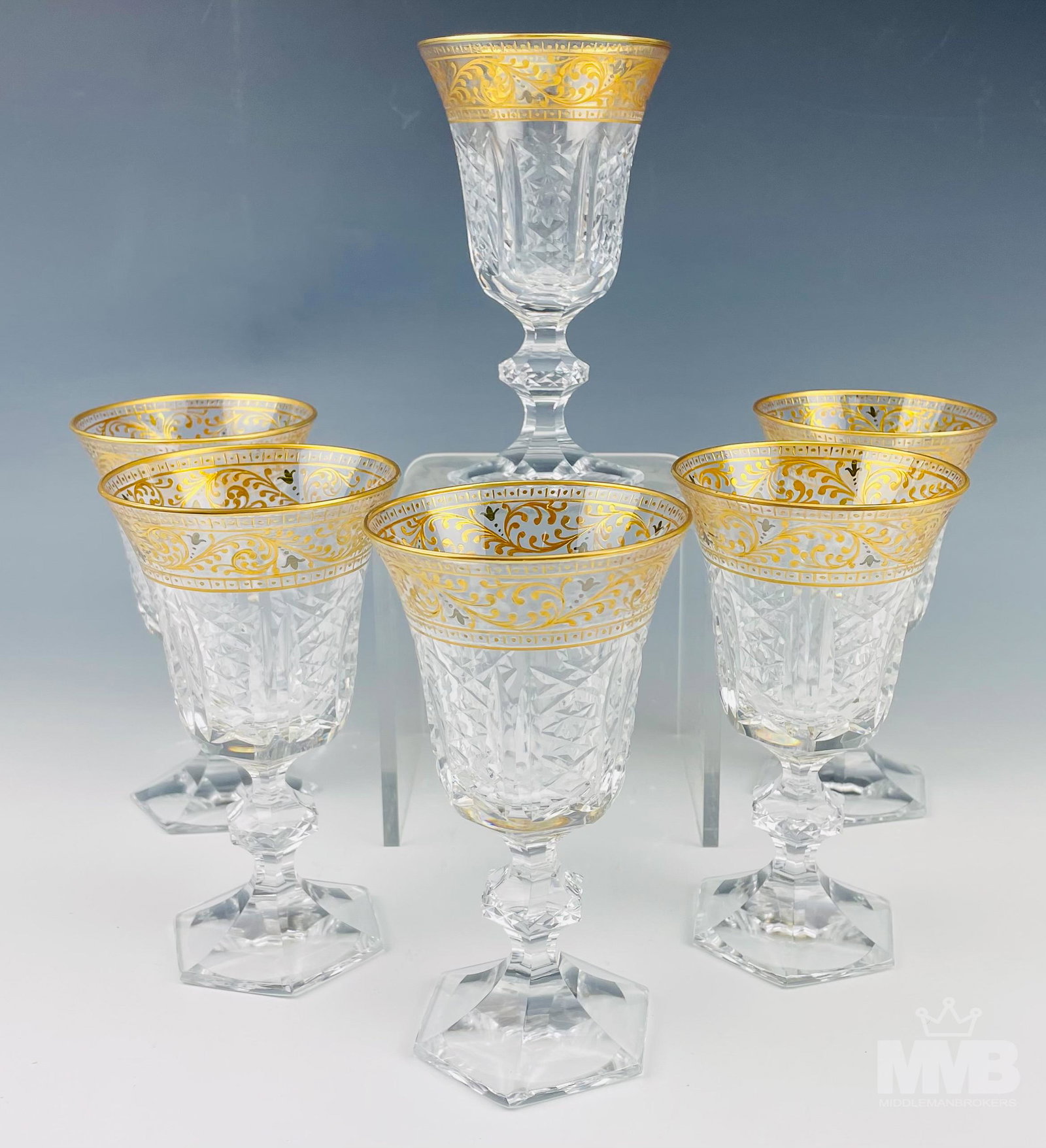 French Gold Gilt Cut Crystal Wine Glass Set: French gold gilt cut crystal Baccarat style wine glasses. Features six gold hand painted encrusted rim crystal wine claret glasses. Dimensions: 6 X 3.5 X 3.5 in. Condition: Good overall condition