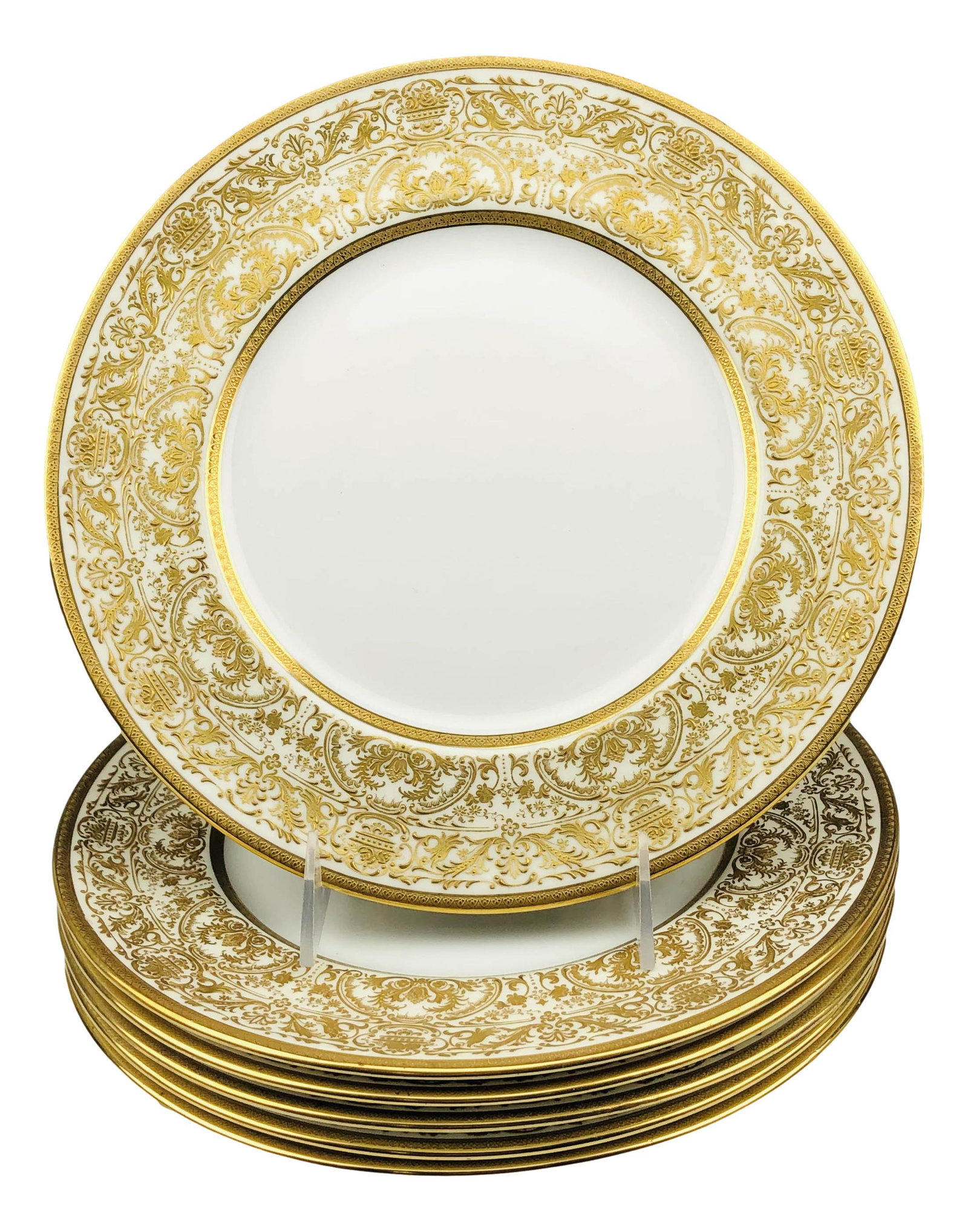 6 Royal Doulton England Gold Gilt Dinner Plates: Lot of six Royal Doulton England JE Caldwell & Co dinner plates. Features a gold gilt designed rim on a white ground. Dimensions: .5 X 10.25 X 10.25 in. Condition: Good to fair overall condition