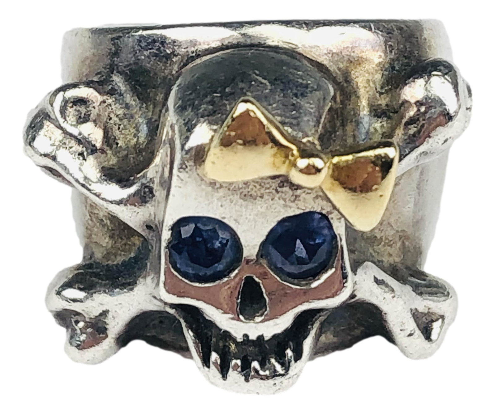 Sterling 18K Gold Blue Tanzanite Skull Ring S 7.5: Designer / artist : Noryne Hiromoto. This skull and bone ring features 18 karat gold accents and blue tanzanites. Stamped 925 and 750 on the inside along with the word Decorus. Hello Skully on the out
