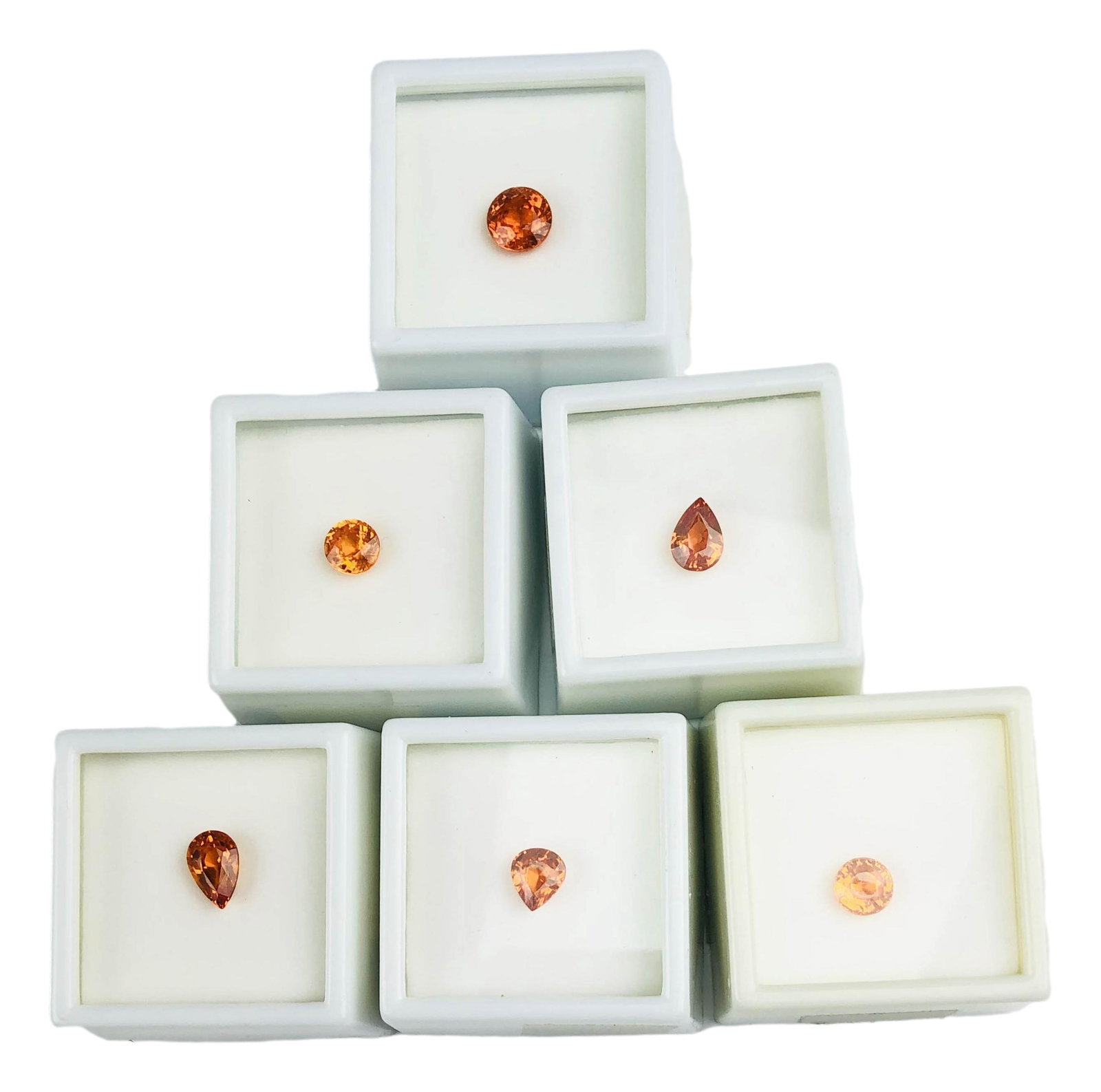 11.75 CT TW Orange Spessartite Garnet 6 Gemstones: Genuine Spessartite garnet gemstone lot. Lot contains: 2.65 carat 8mm round cut gemstone, (3) 2 carat pear shape gemstones, and (2) 1.55 carat 7mm round cut Nigerian Spessartite gemstones. Total combi