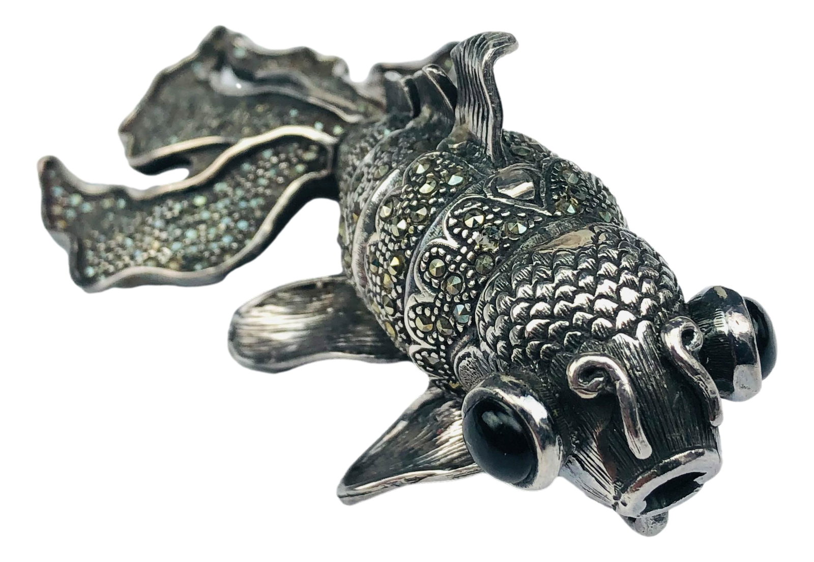 Sterling Marcasite Onyx Articulated Pendant Pin: Handcrafted brooch pin necklace pendant. Features a fantail goldfish embellished with black onyx eyes, the body graced with marcasites. Articulated in manner. Servers as a brooch pin or a pendant. Mea