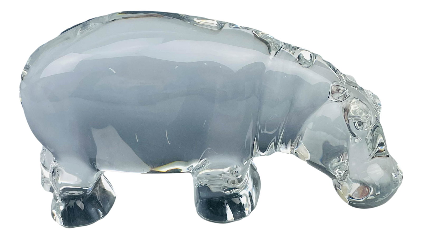 Baccarat France Art Glass Crystal Hippo Figurine: Clear crystal art glass featuring a hippo in standing pose. Sparkling crystal clear clarity. Smooth high mirror polished finish. Measures 3" x 6". Signed with the Baccarat script cursive signature on 