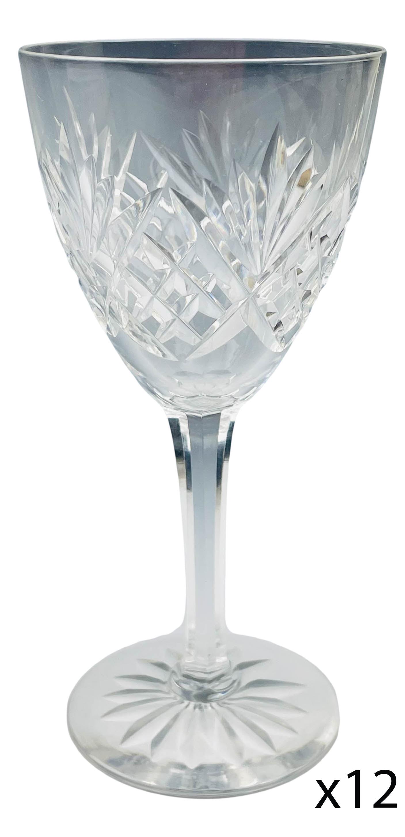 Kosta Boda Crystal Helga 6" Wine Goblet 12pc LOT: Mid century modern Swedish cut crystal water drinking glass goblets modeled in the Helga" pattern. Circa 1965. Design features fan shapes alternating with a diamond quilted pattern. Multifaceted stem 