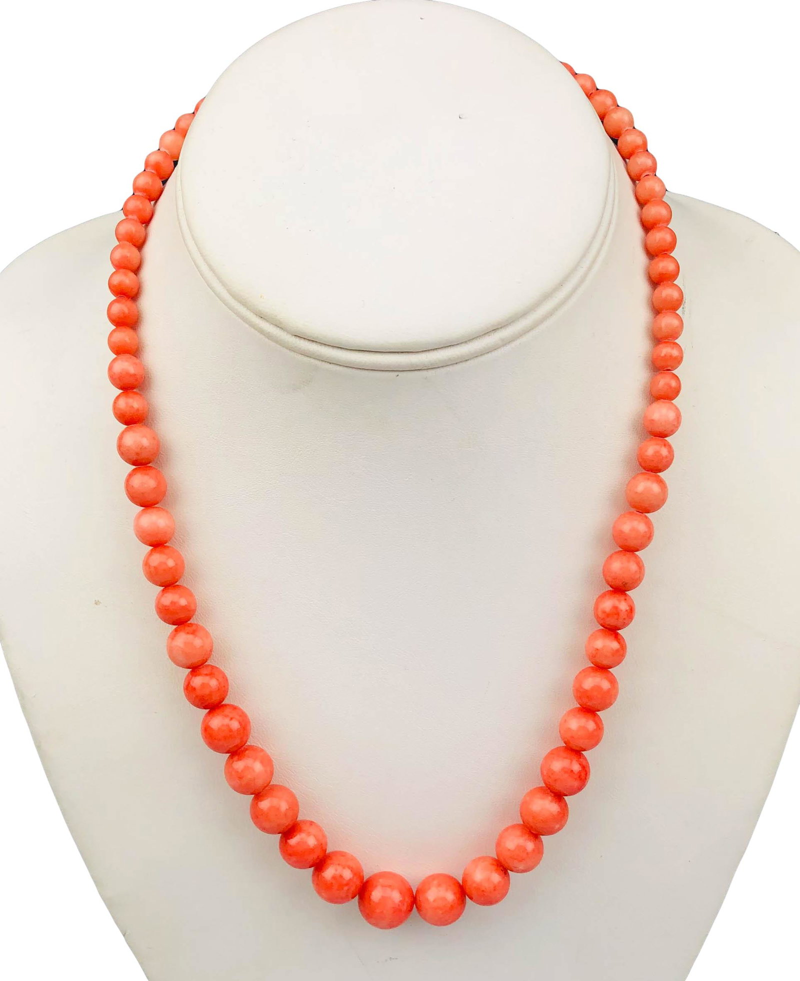 Chinese Export Salmon Red Angel Skin Coral Necklace: Handcrafted single string graduated beaded Salmon red Angel Skin coral necklace. Warm natural color variations. Smooth high mirror polished finish. Measures 18 3/4". Beads measure from 5mm - 11mm. Fin
