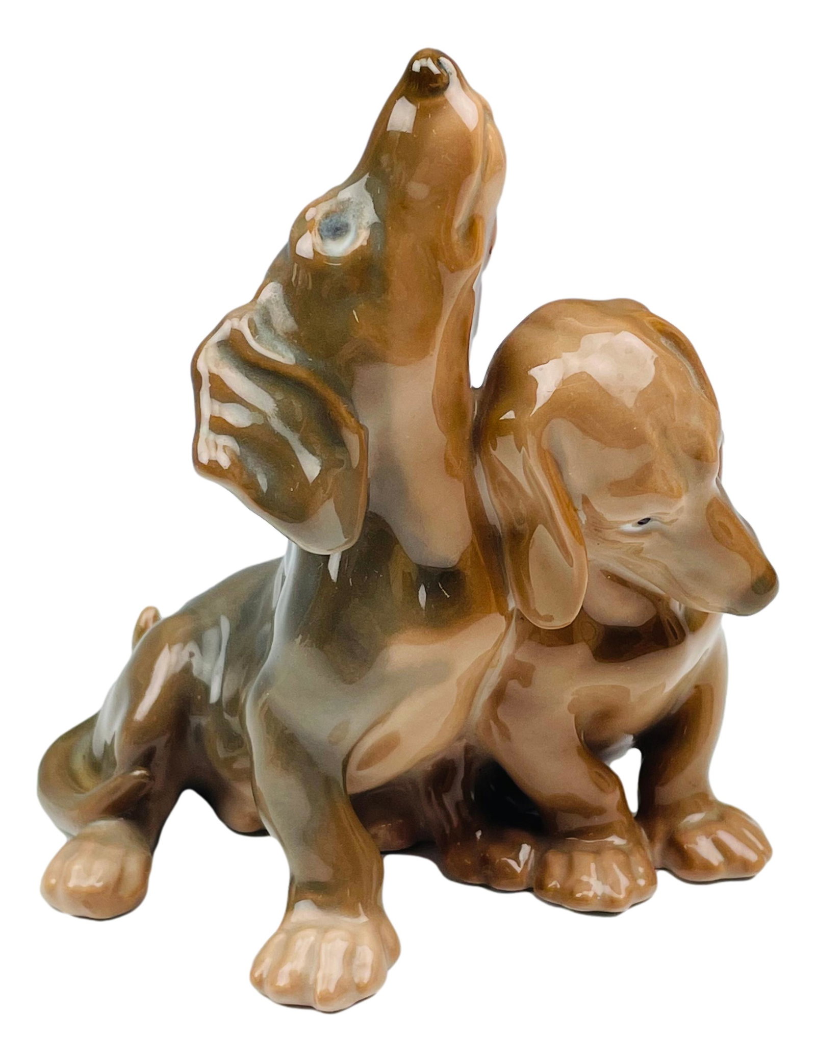 Bing Grondahl Dahl Jensen Dachshund Dog Figurine: Designer : Jens Peter Dahl Jensen ( Danish, 1874 - 1960 ) ~ celebrated and internationally respected sculptor and porcelain painter. Technique : Underglaze. Status : Retired. Features two dachshunds n