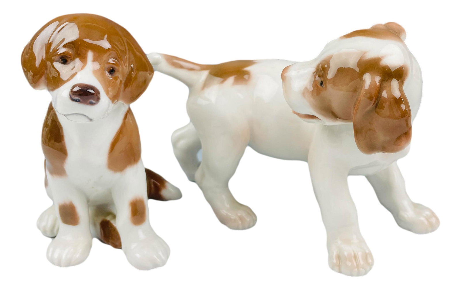 Bing Grondahl B&G Porcelain (2) Dog Figurine LOT: Includes the following porcelain articles ~ 1 x Pointer Puppy Chasing its Tail # 2026. Designed by Lauritz Jensen. 1 x Saint Bernard Puppy # 1926. Designed by Niels Nielsen. Technique : Underglaze. St