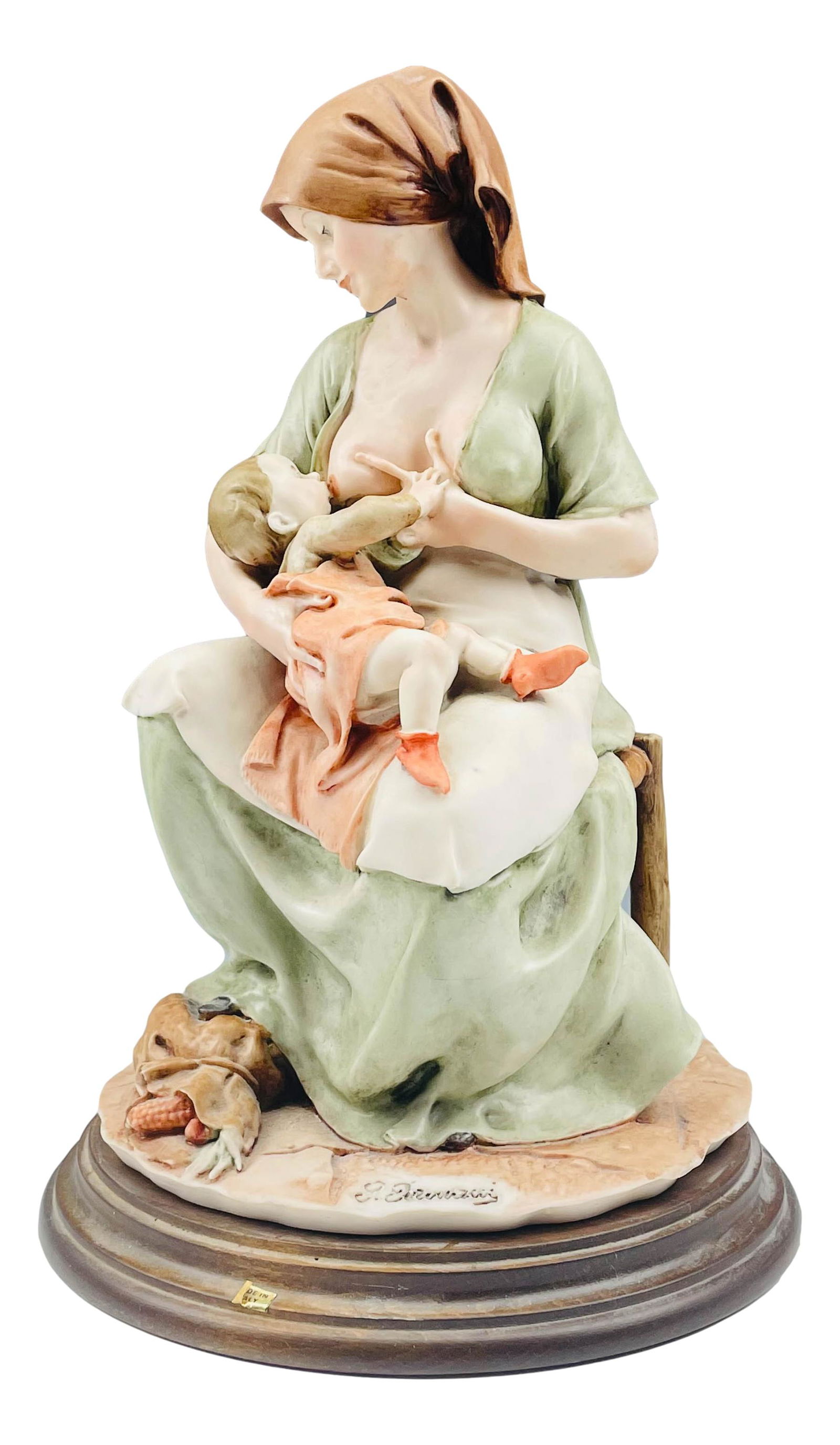 Giuseppe Armani (1935-2006) Maternity Sculpture: Giuseppe Armani ( Italian, 1935 - 2006 ) celebrated sculptor and artist. Known for his detailed and intricate figural creations. This "Maternity" sculpture depicts a mother breast feeding her baby. Me