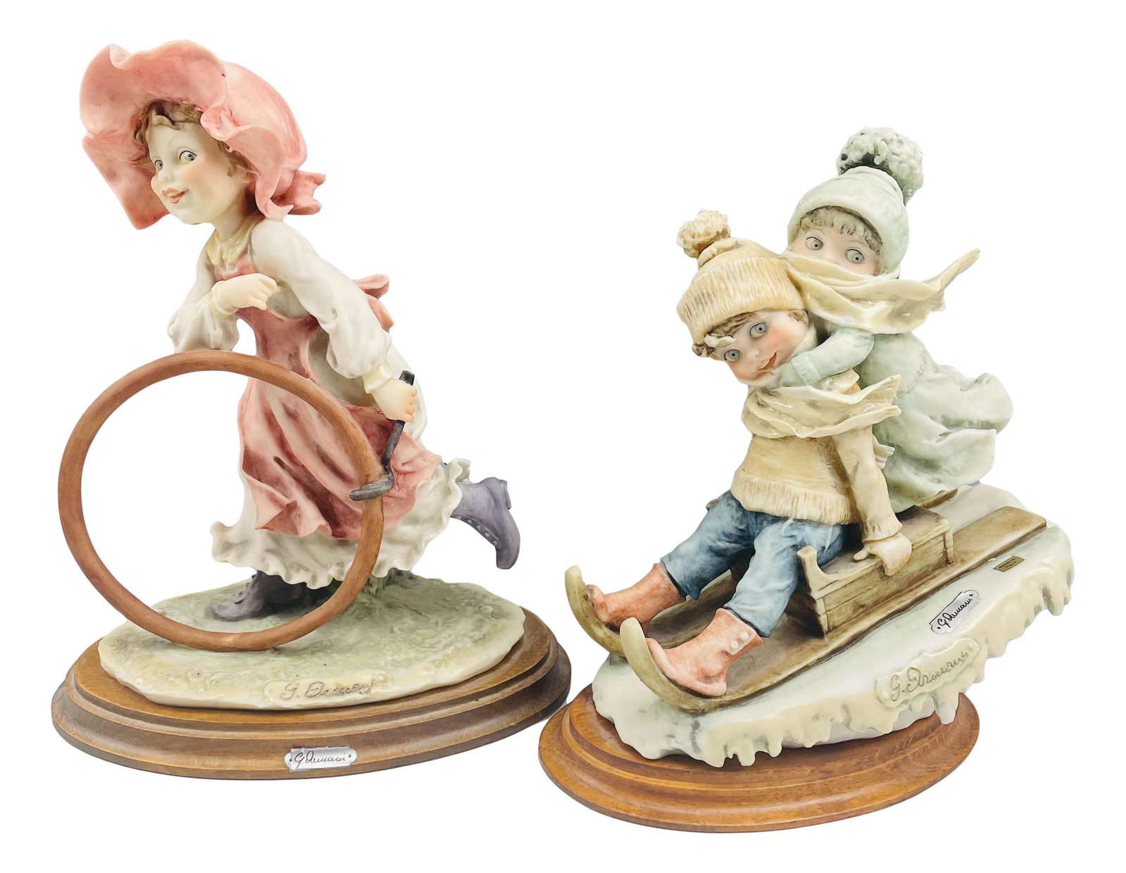 2 Giuseppe Armani (1935-2006) Children Sculptures: Giuseppe Armani ( Italian, 1935 - 2006 ) celebrated sculptor and artist. Known for his detailed and intricate figural creations. One features a girl freewheeling with a hula hoop. The other features c