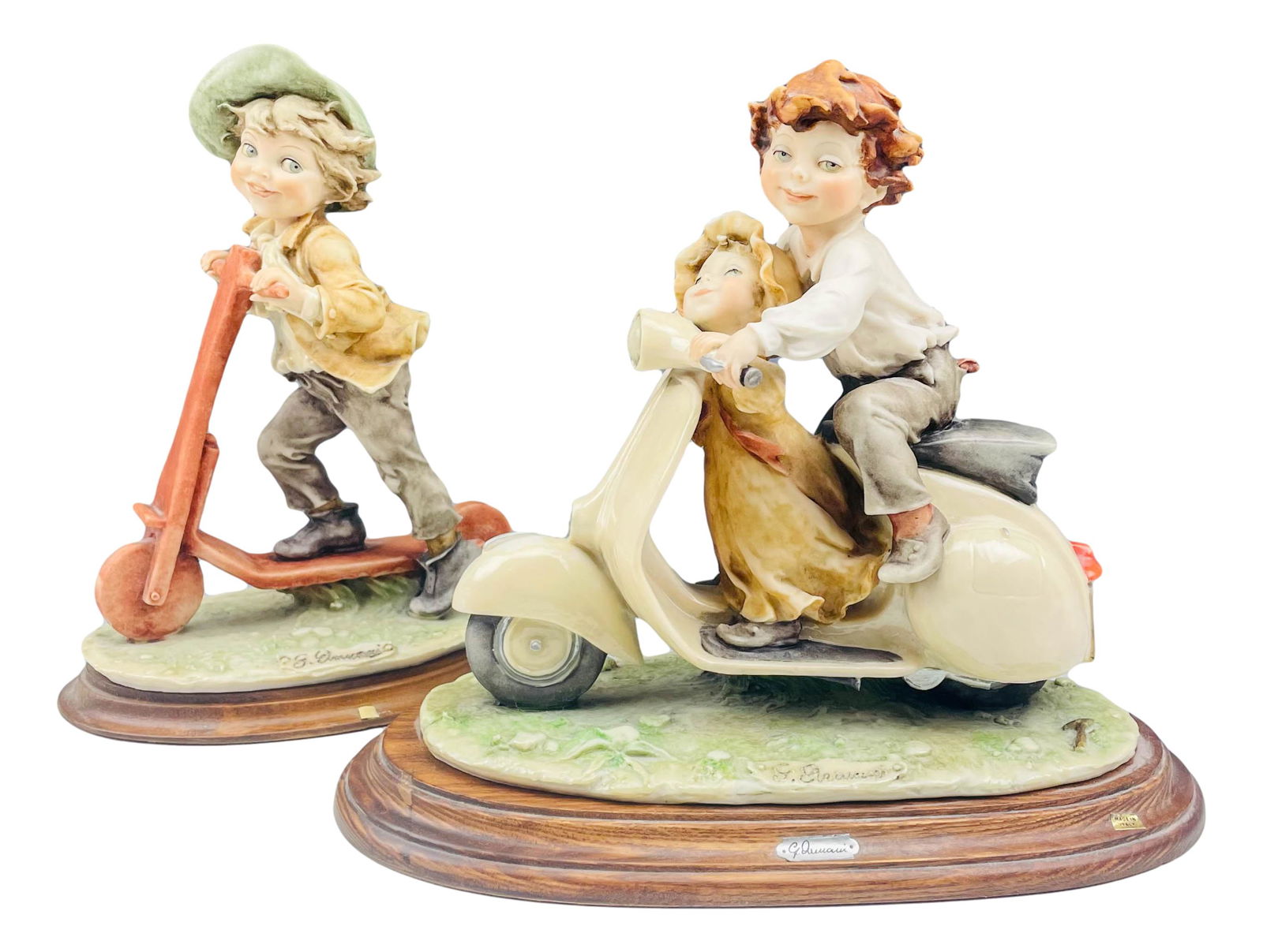 2 Giuseppe Armani (1935-2006) Children on Scooter: Giuseppe Armani ( Italian, 1935 - 2006 ) celebrated sculptor and artist. Known for his detailed and intricate figural creations. One features a boy riding his scooter. The other features a brother and