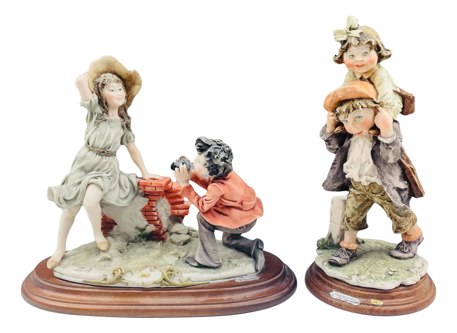 2 Giuseppe Armani (1935-2006) Children Sculptures: Giuseppe Armani ( Italian, 1935 - 2006 ) celebrated sculptor and artist. Known for his detailed and intricate figural creations. One depicts a young boy giving his sister a piggyback ride. The other f