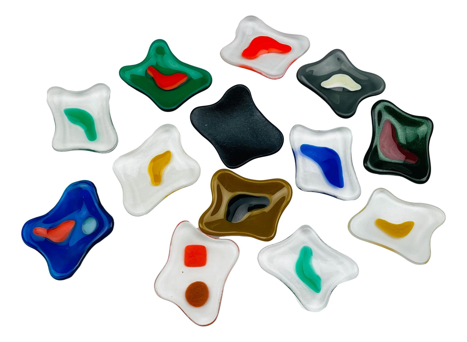 Murano Art Glass Freeform Spoon Rest Trivets LOT: Collection of 13 Murano art glass multi colored trivets. Can be used as salt and pepper holder or a spoon rest. Dimensions: 1.5 X 2.5 X 2 in. Condition: Good condition having average wear. Estate