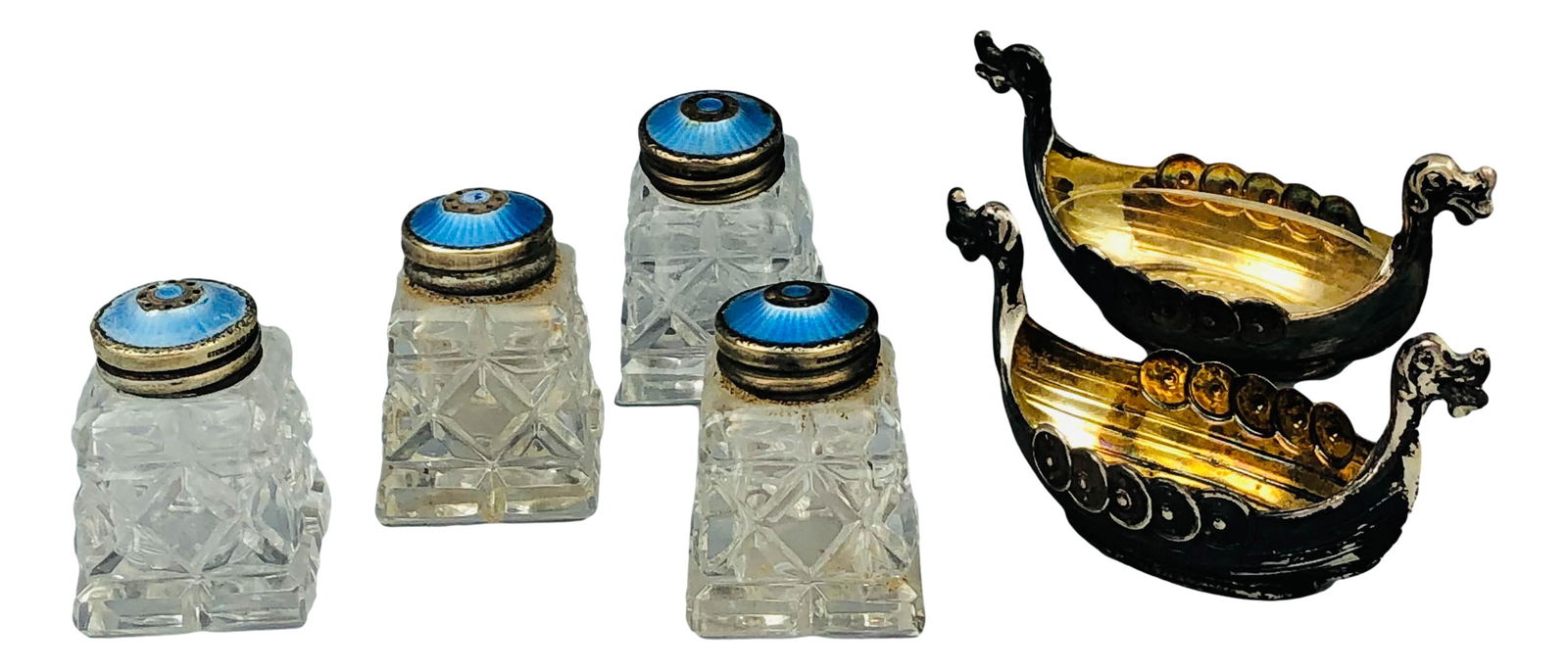 Norway Sterling Enamel Salt Pepper Shakers LOT 6: Includes the following Norwegian origin articles. 4 x glass with sterling enamel top salt and pepper shakers. 2 x sterling Viking ship salt cellars one having a removable glass insert bowl. Measure 1